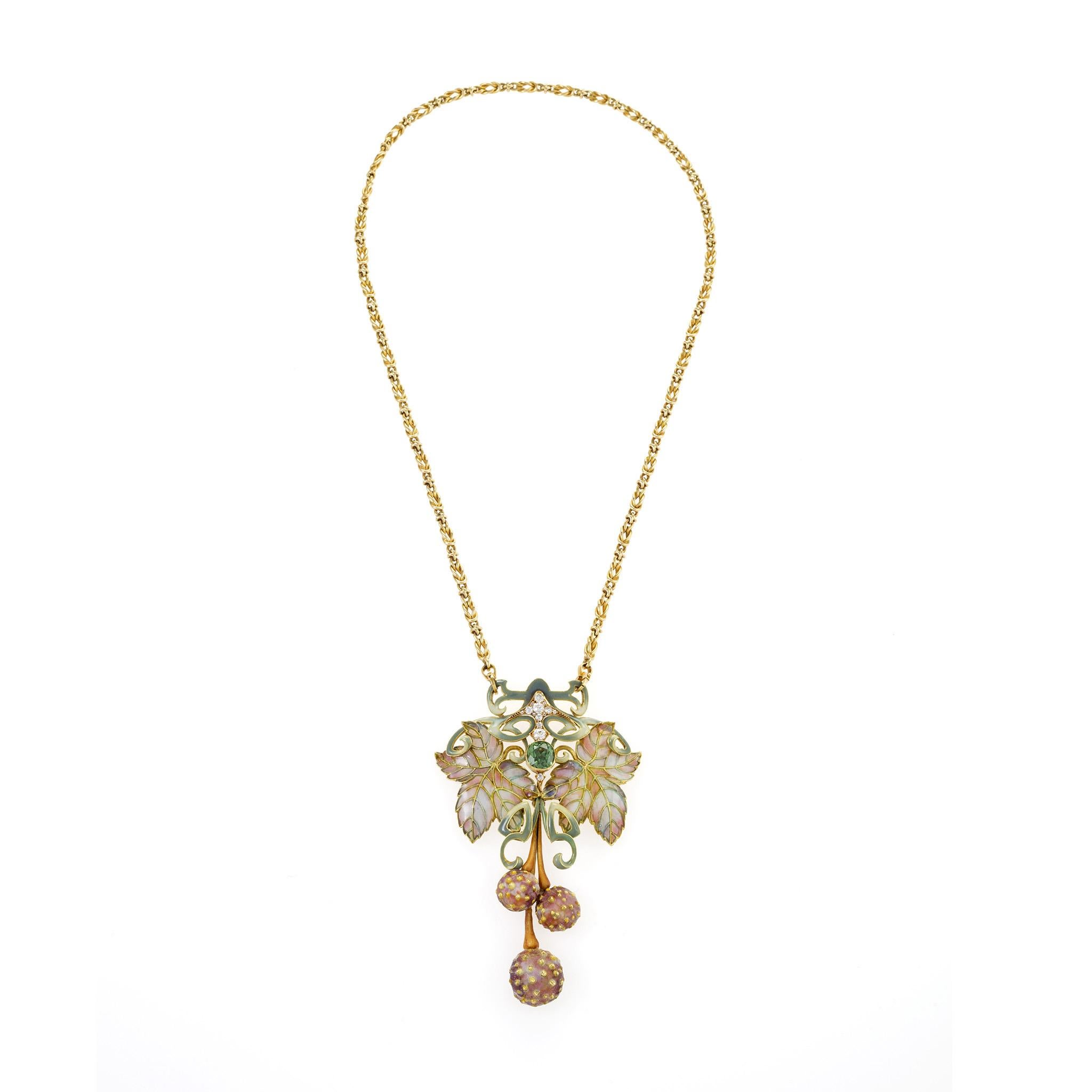 A masterwork of Art Nouveau jewelry, this elegant gold pendant necklace is composed of plique-á-jour enamel, en plein enamel, demantoid garnet and diamonds. A sensitive representation of the European plane tree, the delicately shaded greenish gray,