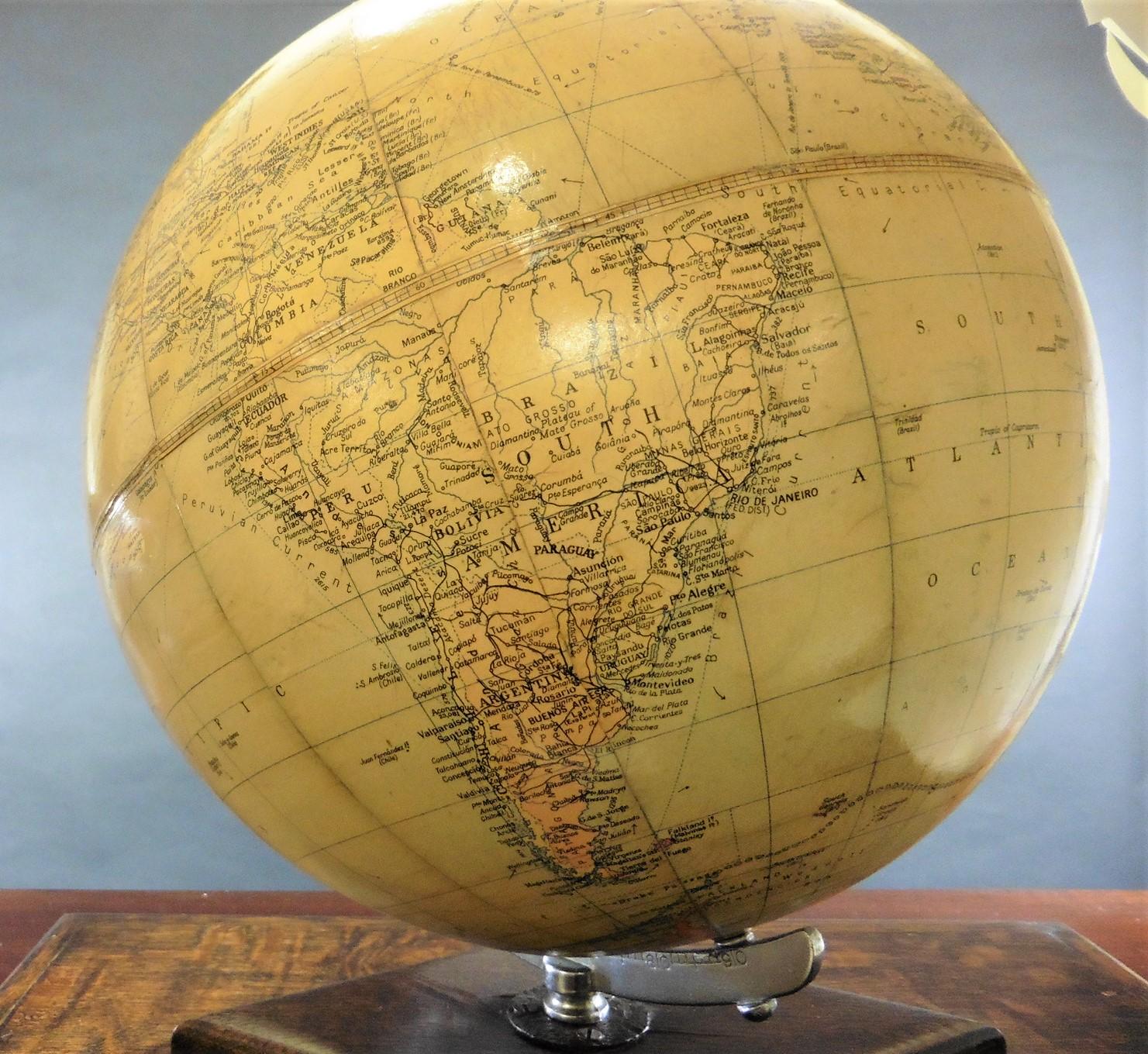 Philips 10 inch challenge globe

Philips 10 inch globe standing on a raised oak chamfered base and resting on a rectangular oak base incorporating a ribbon pull to reveal it’s original Graphic Atlas by Bartholomew ( it is rare to find one of these