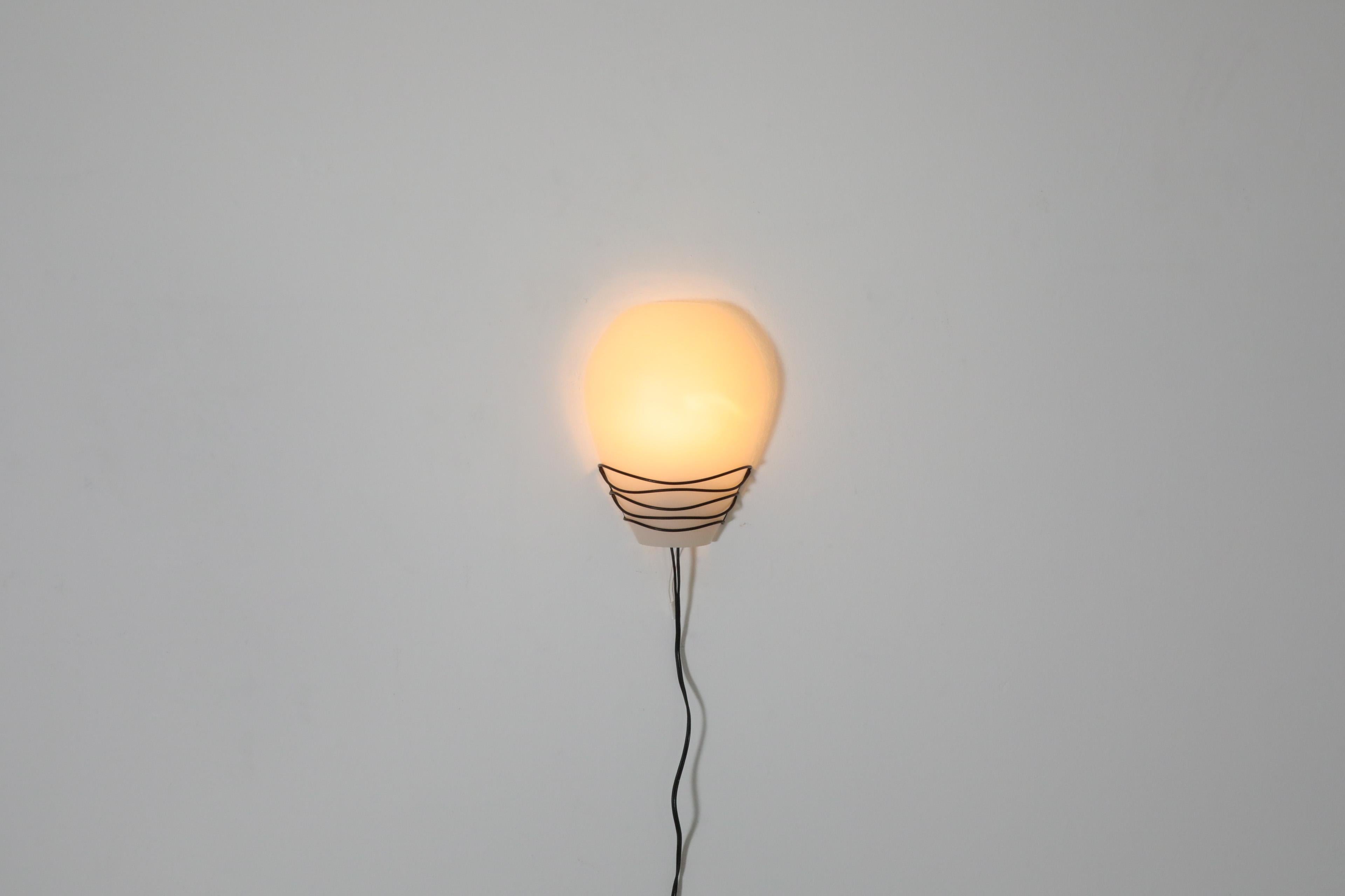 Mid-Century Modern Philips Wall Sconce with Black Wire Mount and Milk Glass Shade, 1950's For Sale