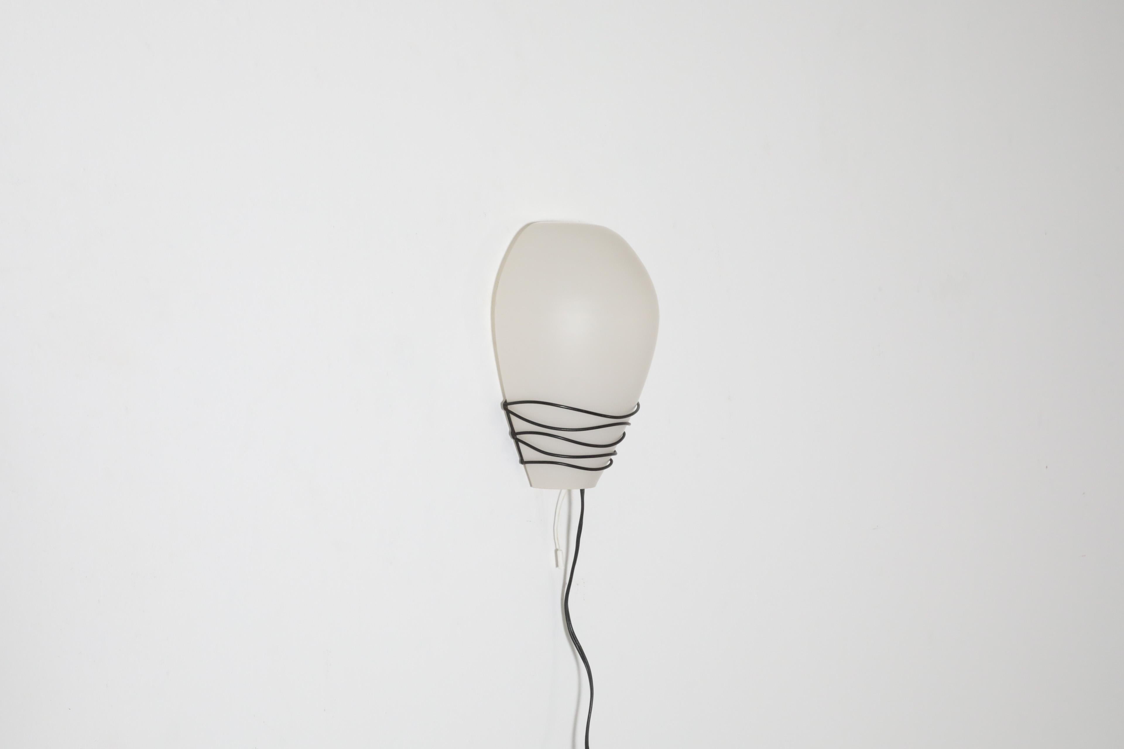 Mid-20th Century Philips Milk Glass Wall Sconce w/ Black Wire Mount and Milk Glass Shade, 1950's For Sale