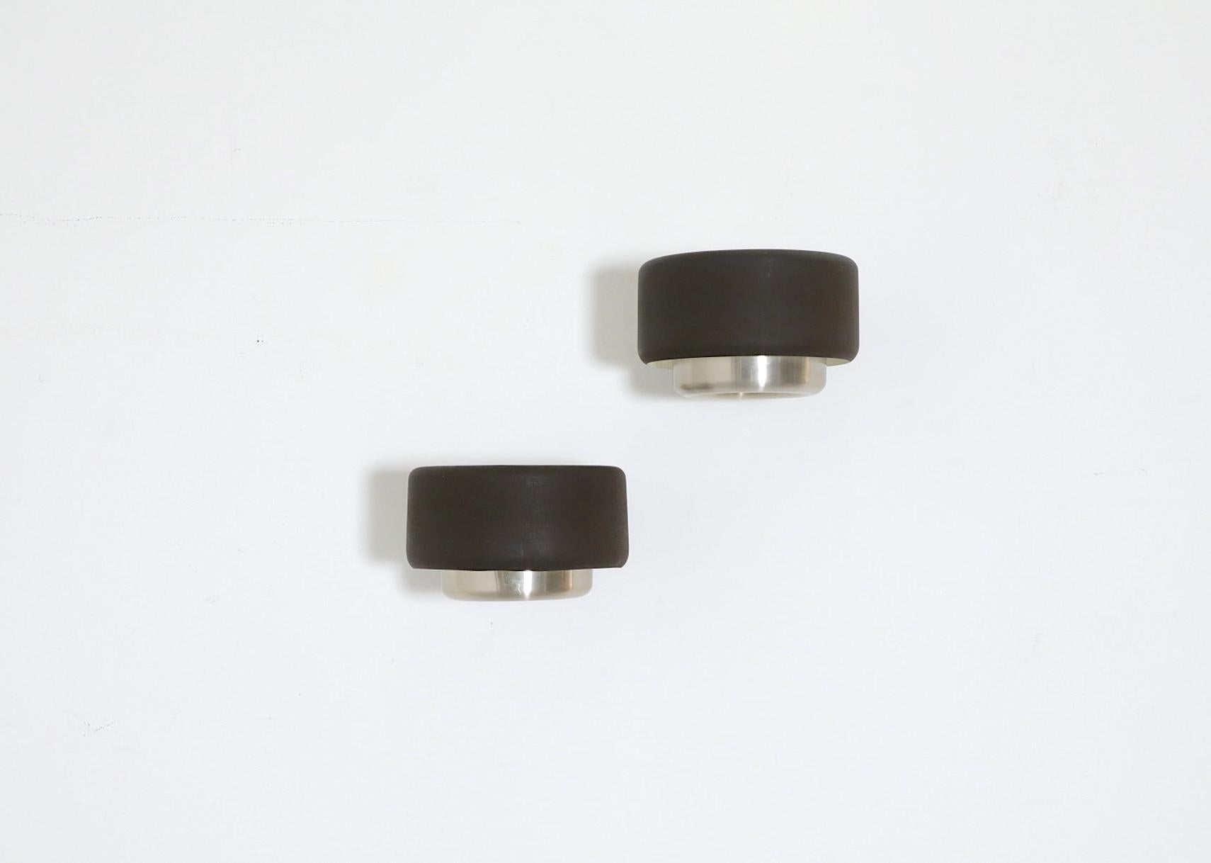 Philips pill shaped sconce with brown enameled metal banded shade, a lower spun aluminum donut shaped design and milky acrylic diffusers that sit above the bulb. In original condition with visible wear consistent with their age and use. Sold