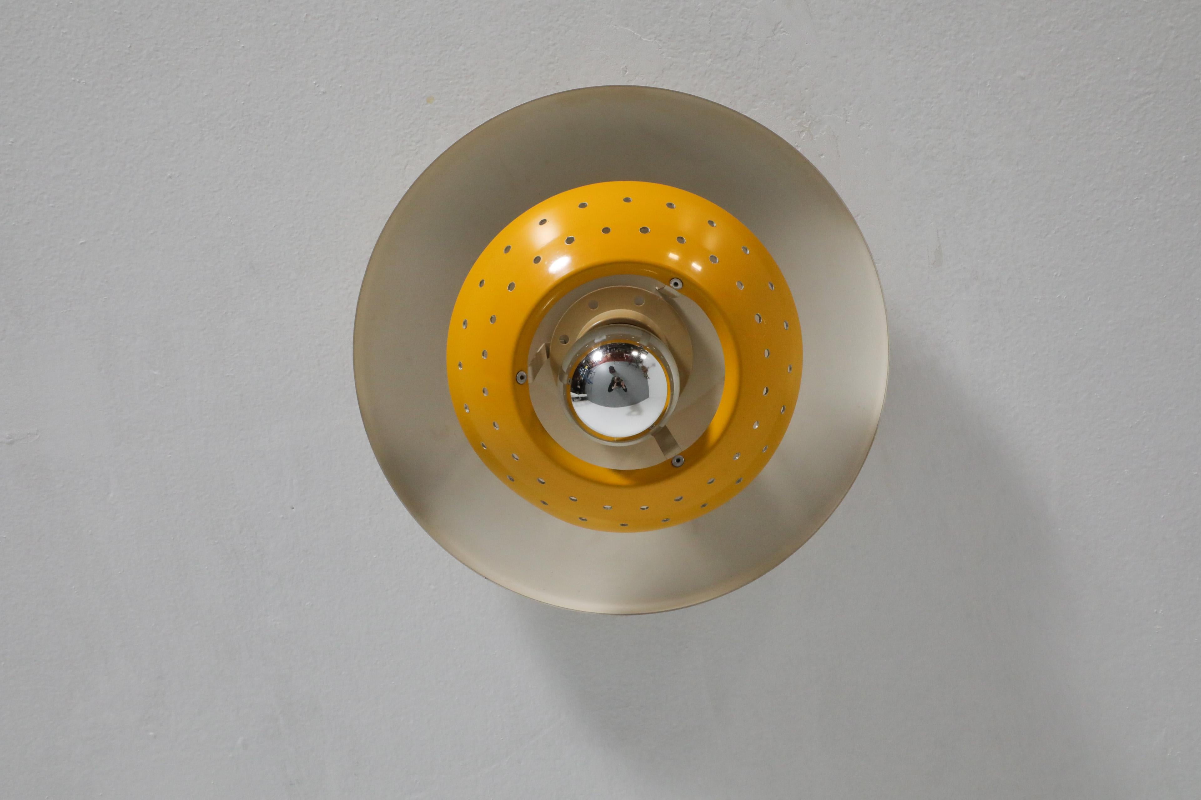 Late 20th Century Philips Style Perforated Yellow Enameled Metal Ceiling Lamp For Sale