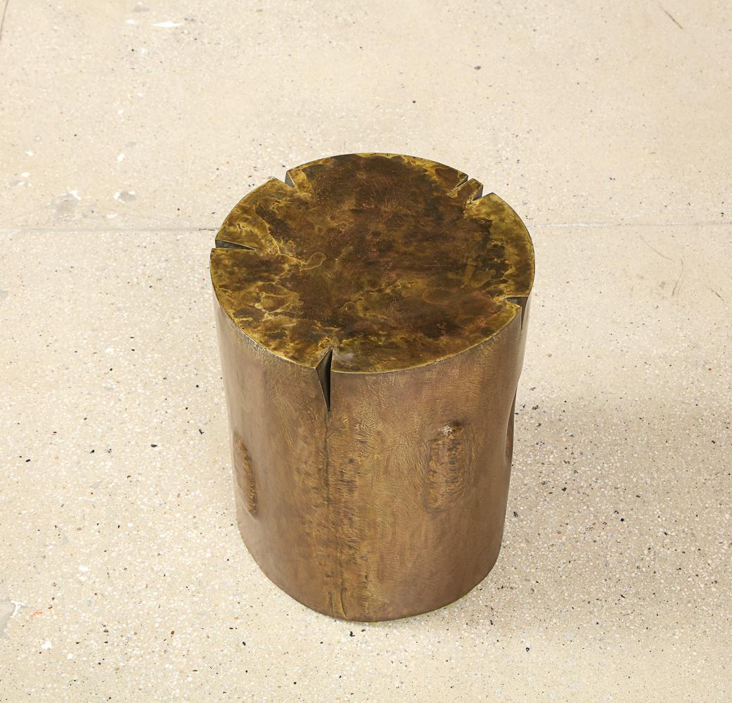 Poem, rare side table by Phillip and Kelvin LaVerne. Oxidized & patinated bronze table. Cylindrical form resembling a small tree trunk, with indentations & relief areas around the side. This table is 1 of only 2 examples known to have been made.