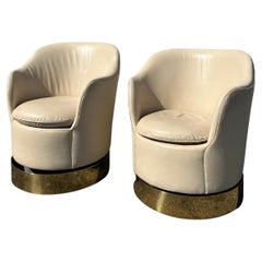 Retro Phillip Enfield Brass Swivel Lounge Chairs, a Pair