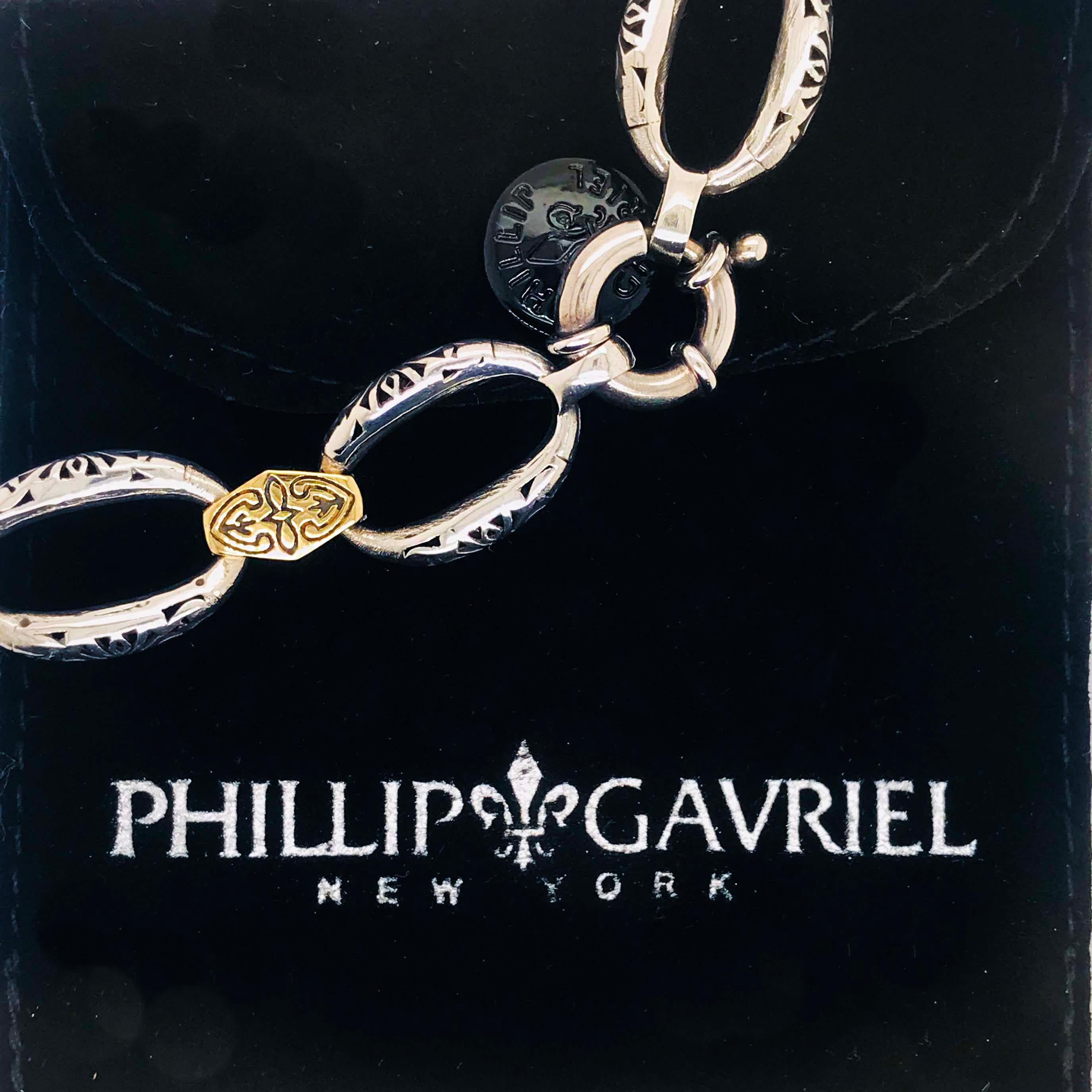 This original Phillip Gavriel link bracelet is made in Italy and designed by Phillip Gavriel. Created with precious metals, 18K yellow gold and sterling silver. Each link has been handmade and crafted together. The links are oval with open filigree