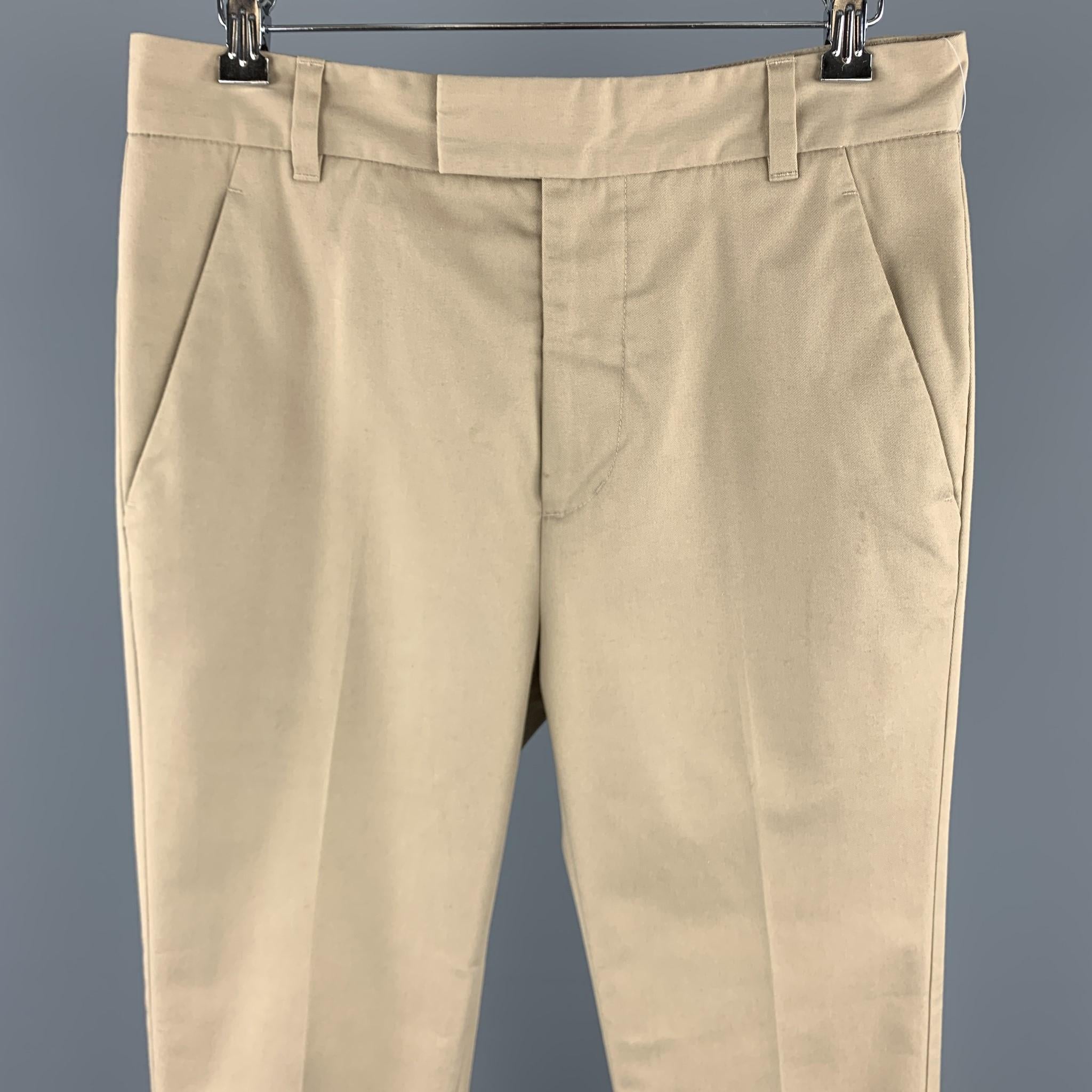 PHILLIP LIM casual pants comes in a solid khaki cotton blend material, featuring a tab front, seam and slit pockets, zip fly. 

Excellent Pre-Owned Condition.
Marked: US 28 / 30 Skinny Fit

Measurements:

Waist: 31 in. 
Rise: 11.5 in. 
Inseam: 26.5