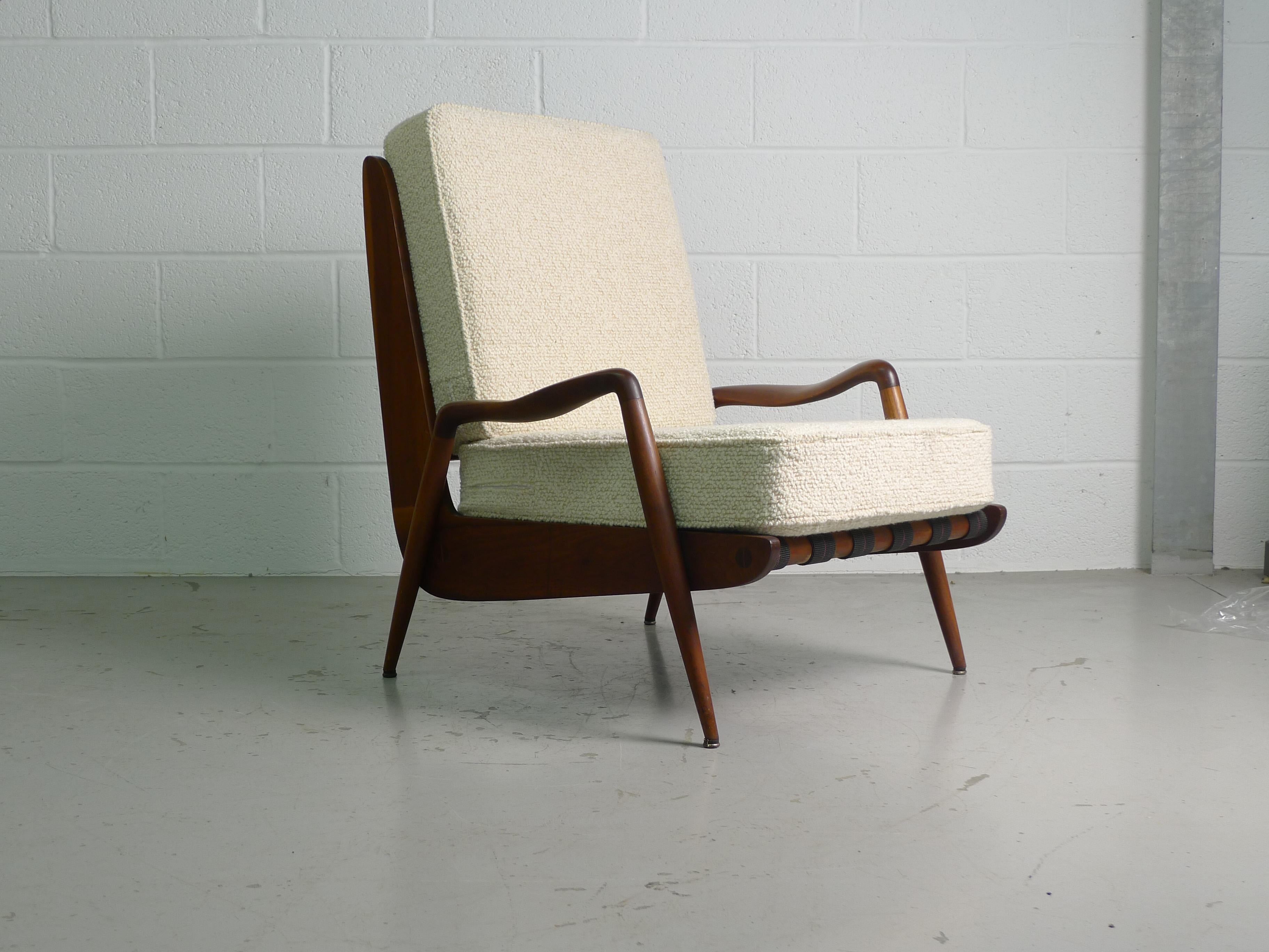 Phillip Lloyd Powell, 1960s, lounge chair in American Walnut and newly reupholstered nubbly wool fabric cushions.

Sculpted arms contribute to a beautiful overall form.