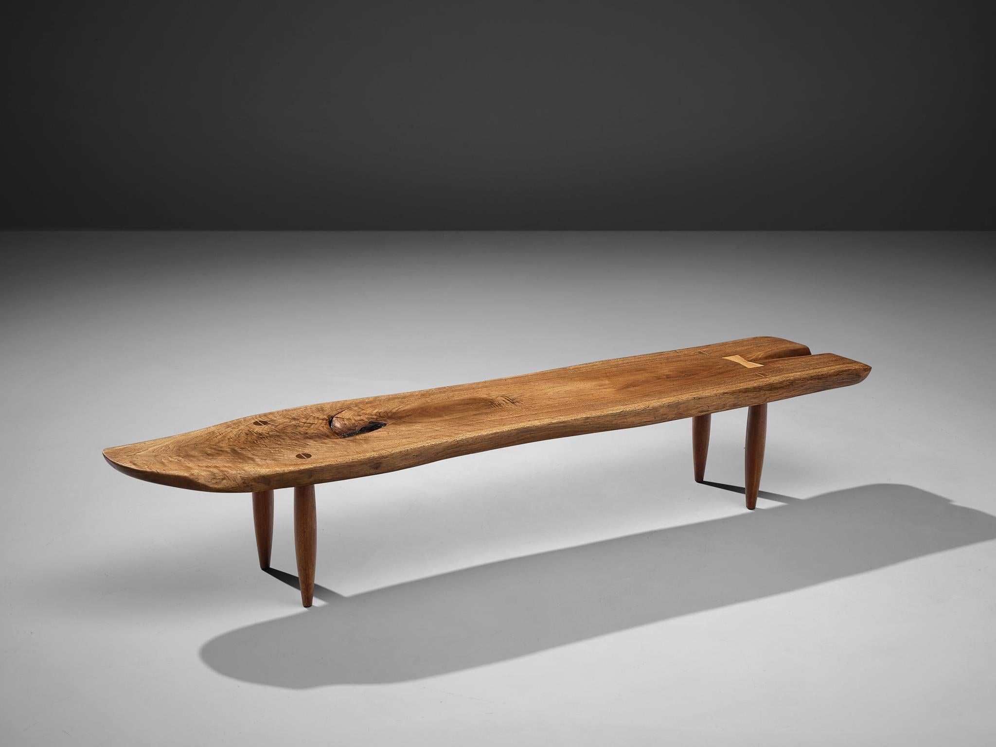 Phillip Lloyd Powell, coffee table, walnut, United States, 1960s

Stunning coffee table with free edges by US designer Phillip Lloyd Powell. On four circular tapered legs Powell places a long tabletop that follows the characteristics of the natural