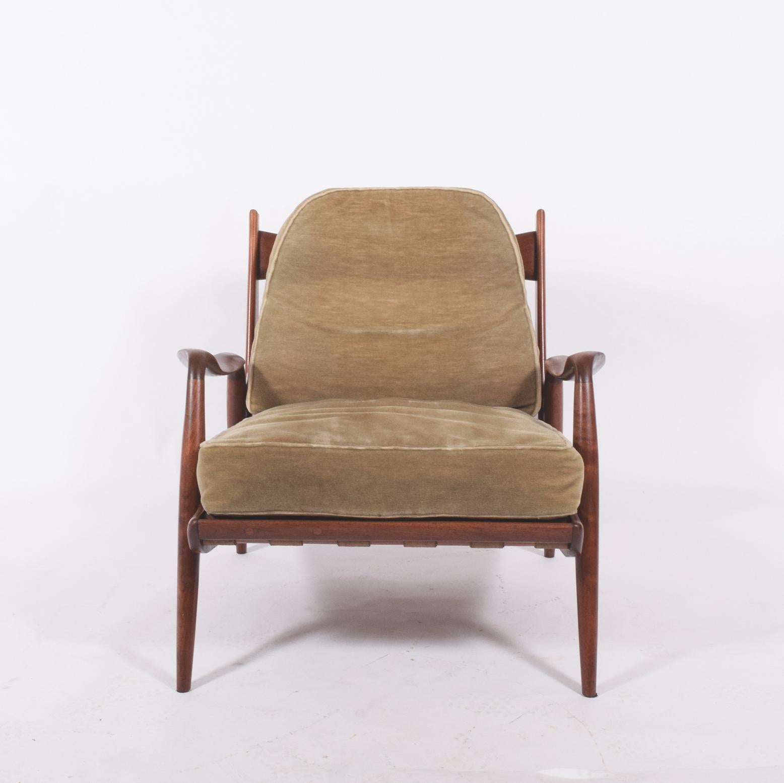 Early Studio new hope lounge chair sculpted in American black walnut by Phillip Lloyd Powell, original webbing original condition and upholstery purchased directly from Phillip Lloyd.