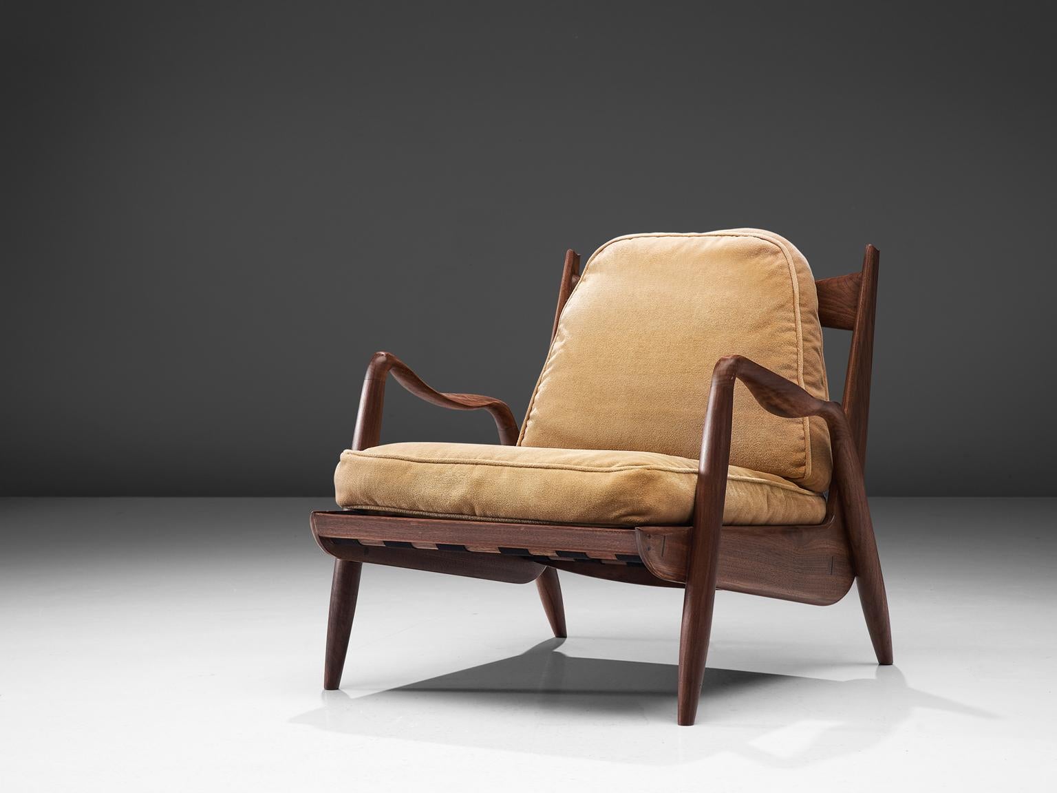 Philip Lloyd Powell, New Hope lounge chair, American walnut and beige velvet, United States, 1960s. 

This sculptural armchair executed in American walnut and velvet upholstery is designed by Philip Lloyd Powell. The name 'New Hope' is a reference