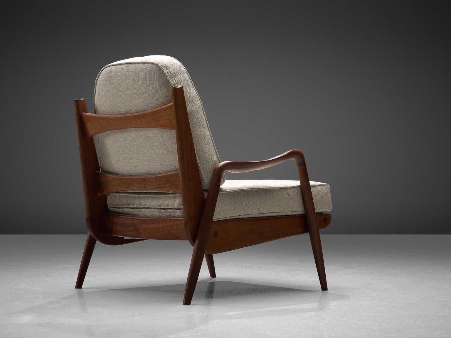 Philip Lloyd Powell, New Hope lounge chair, American walnut and off-white velvet, United States, 1960s. 

This sculptural armchair executed in American walnut and fabric upholstery is designed by Philip Lloyd Powell. The name 'New Hope' is a
