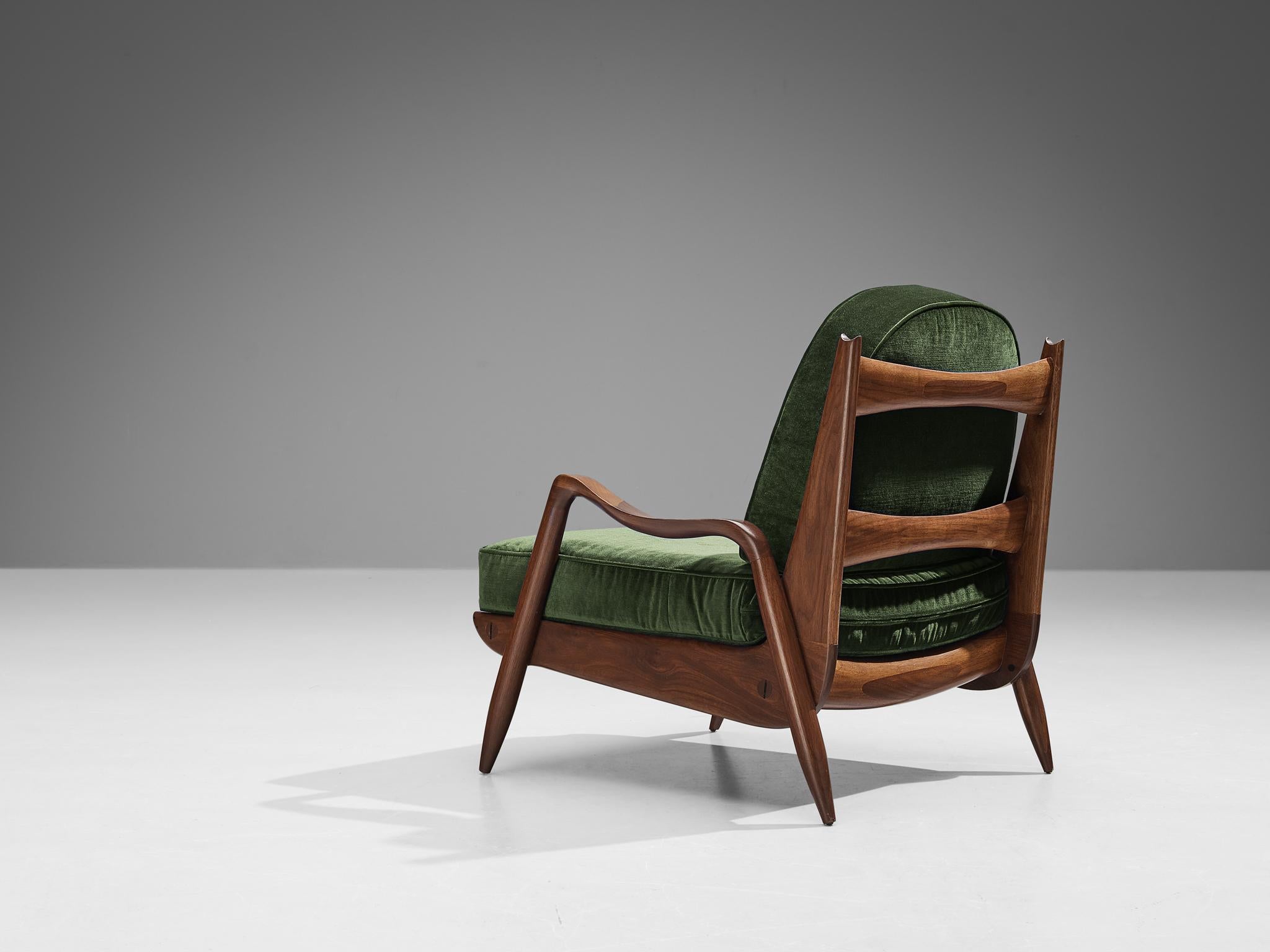 Philip Lloyd Powell, 'New Hope' lounge chair, American walnut, green velvet, United States, 1960s.

This utterly comfortable armchair is designed by American master Philip Lloyd Powell. One of the most important properties of this design is the