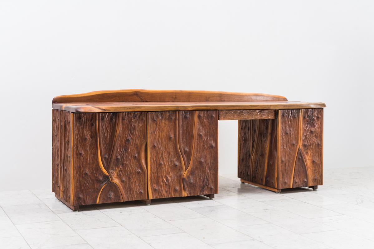 This organic executive desk, a custom commission for a private collector, is one of the best examples of Powell’s affinity for natural wood and his mastery in creating unique works that highlight wood’s inconsistencies rather than masking them. The
