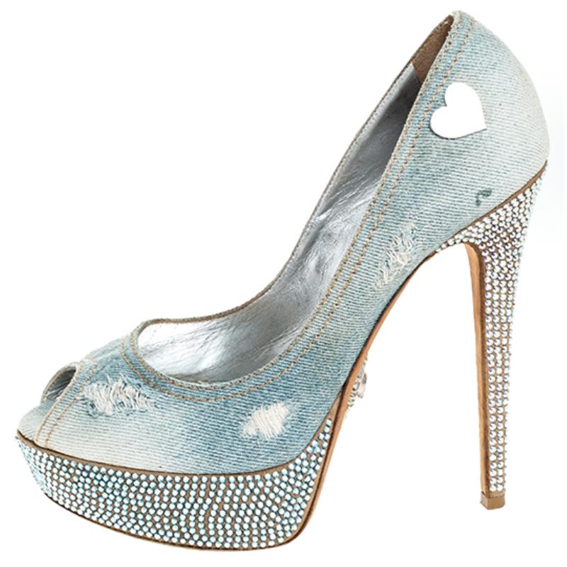 Match your outfit with these denim pumps and complete your look. This pair of pumps from Phillip Plein features a distressed effect and heart appliques on the quarters. They are adorned with peep-toes along with embellished platforms and high
