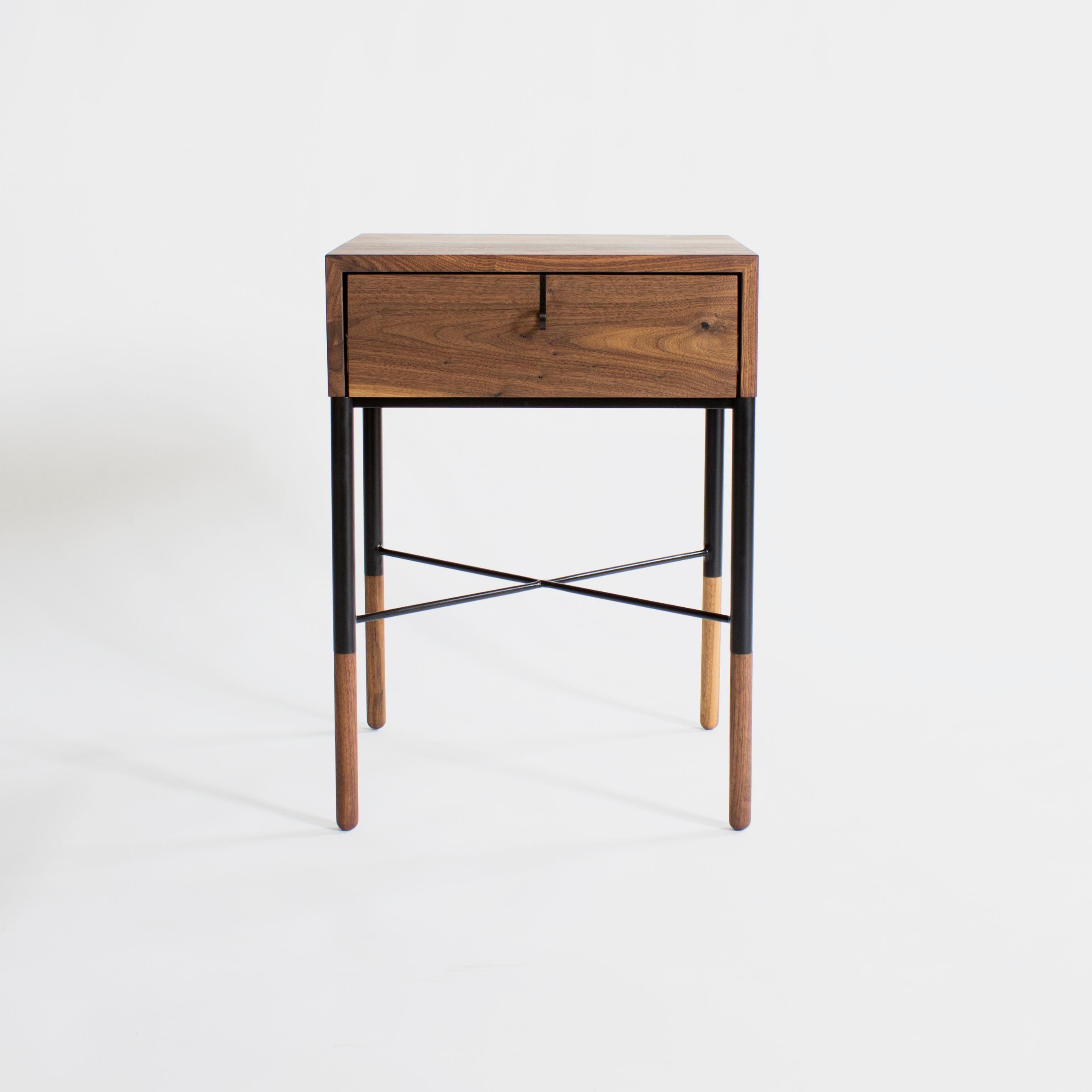 Phillip Nightstand 
by Crump and Kwash 

Solid wood case with continuous waterfall grain / blackened steel pulls and base / hand shaped walnut feet / natural oil finish.

Wood Options - Walnut, White Oak, Maple, Black Oak 

Customizations Available 