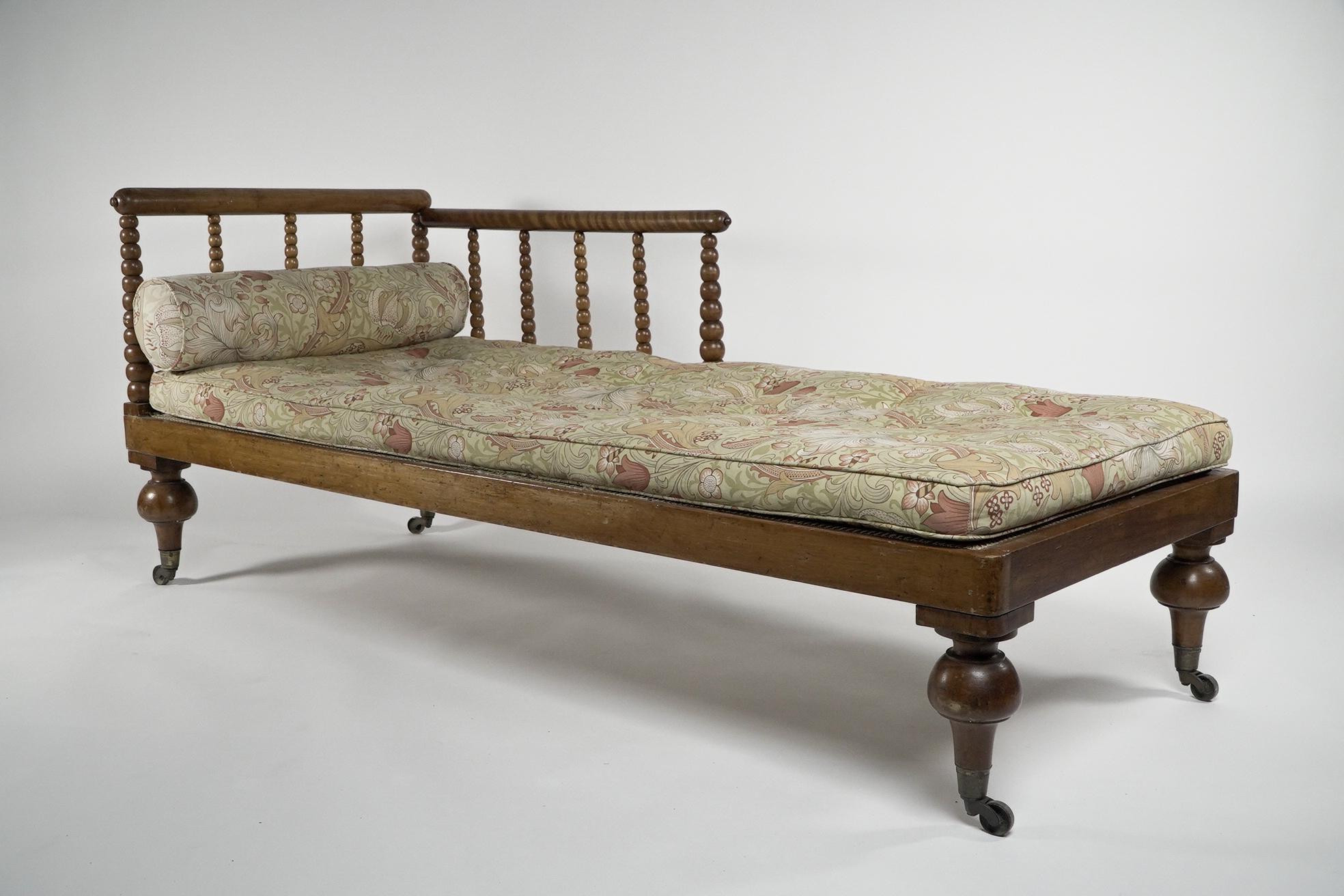Phillip Webb for Morris and Co attributed. A larger than usual Aesthetic Movement bobbin turned Satinwood chaise lounge or day bed, the upper turned armrests with typical Morris and Co nipples to each end, united with turned ever decreasing in size