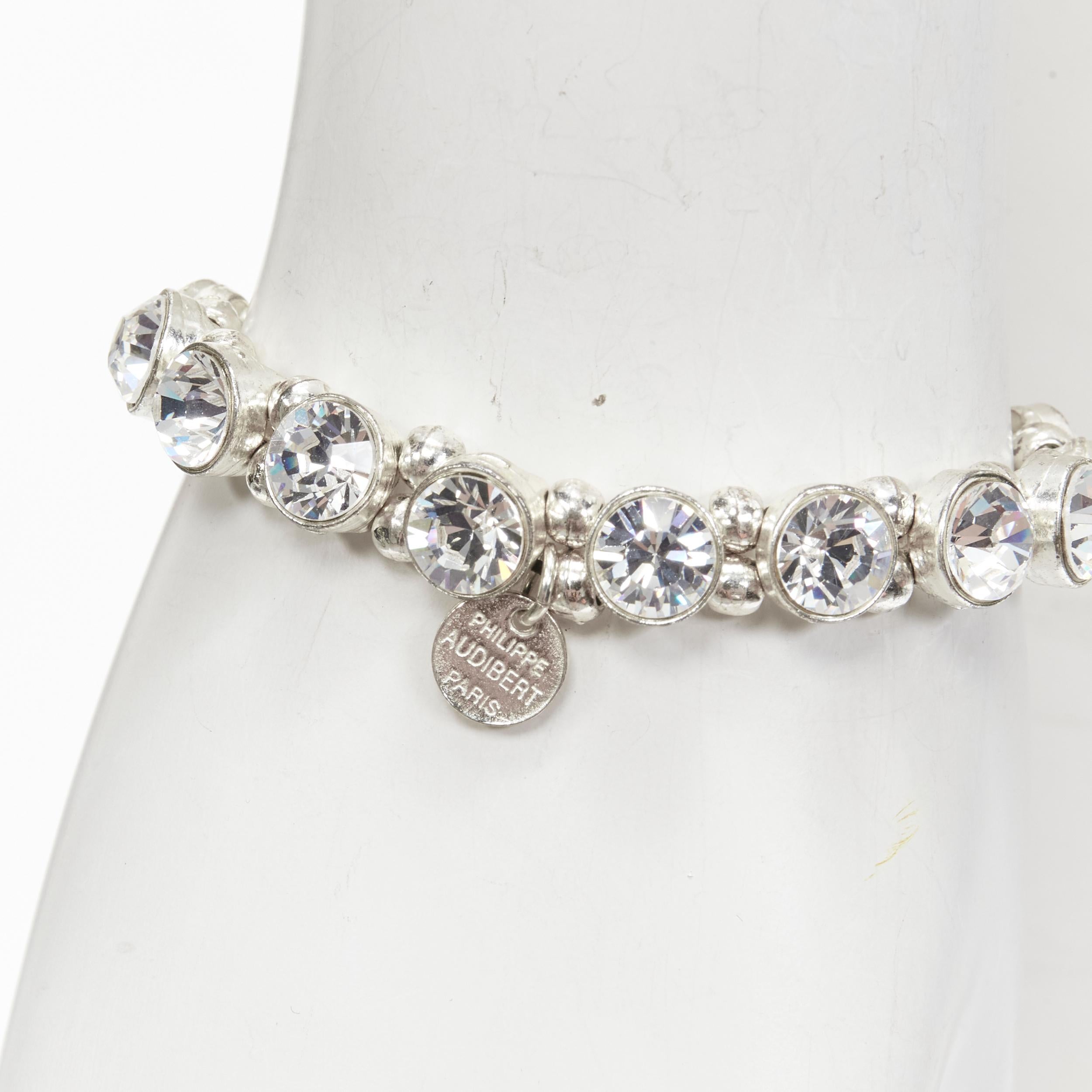 PHILLIPE AUDIBERT silver round crystal beads chain elastic bracelet
Reference: ANWU/A00289
Brand: Phillipe Audibert
Material: Metal
Color: Silver
Closure: Elasticated
Extra Details: Brand name logo plate.

CONDITION:
Condition: Very good, this item