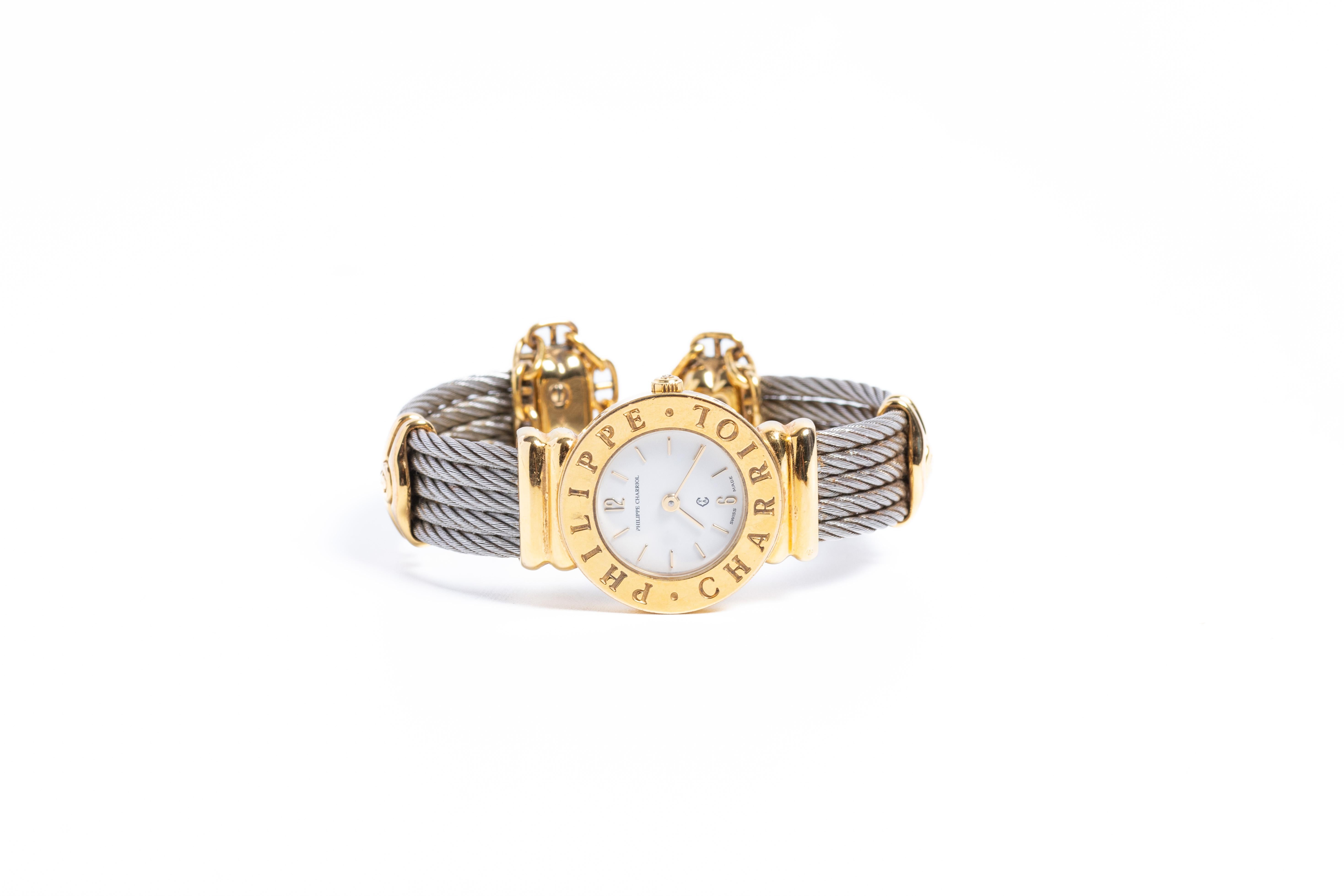 Philippe Charriol gold plated and stainless steel ladies wristwatch. A beautiful and elegant design with in twith gold end caps marked with the Charriol 'C' symbol. 

This original Swiss-made quart timepiece has a braided cable motif on the strap