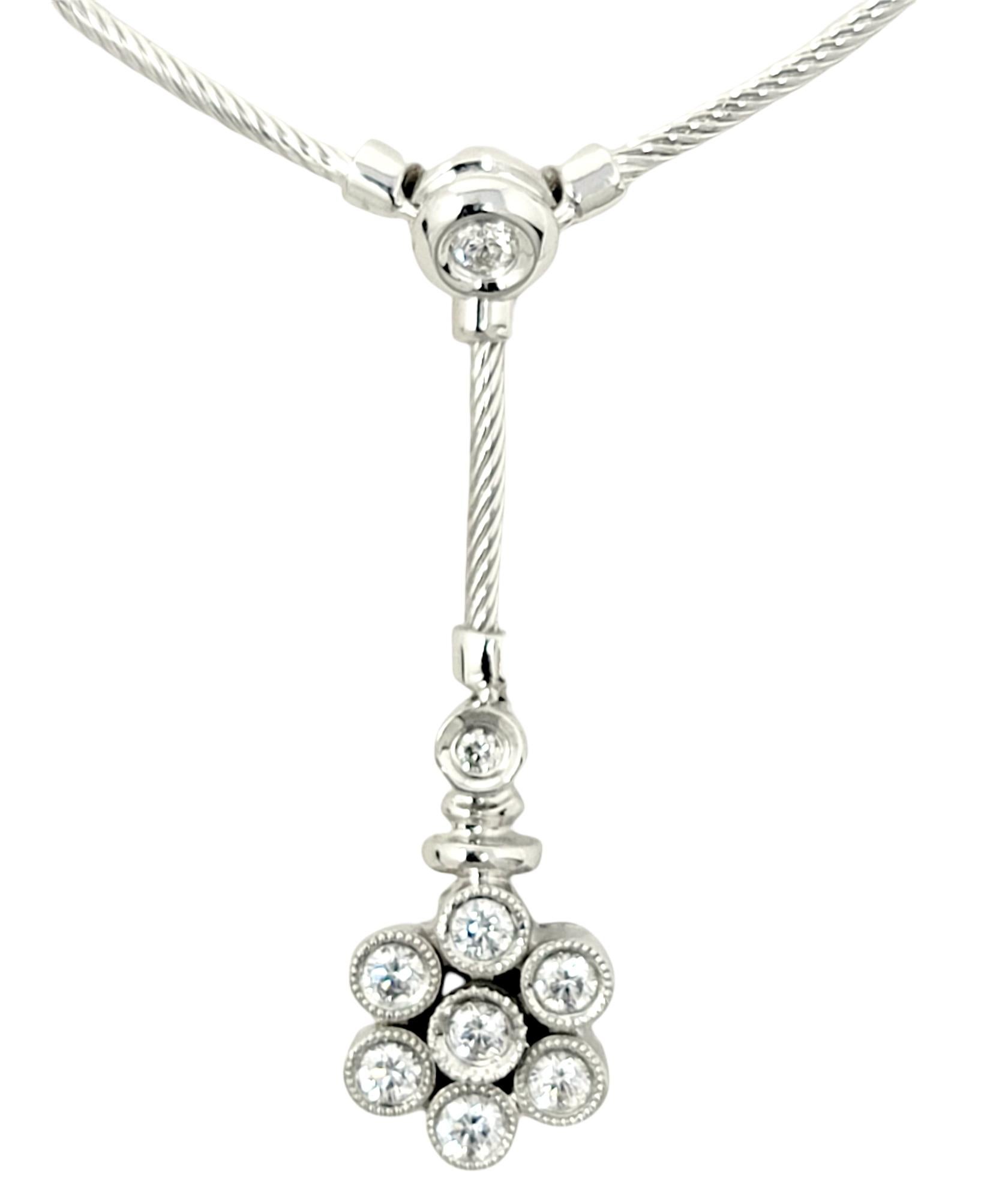 Lovely feminine diamond and cable station necklace by Philippe Charriol with a gorgeous diamond embellished floral drop charm. 

Metal: 18 Karat White Gold
Natural Diamond: .41 carats
Diamond cut: Round Brilliant
Diamond color: G-H
Diamond clarity: