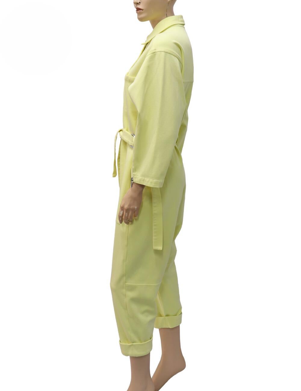 Phillips Lim Pastel Yellow Knit Twill Utility Jumpsuit, Features a Heavyweight jersey, Collared neckline, Snap flap and hidden zip placket, Long sleeves with zip cuffs and a Patch front and back pockets.

Material: 65% viscose/ 31% nylon/ 4%