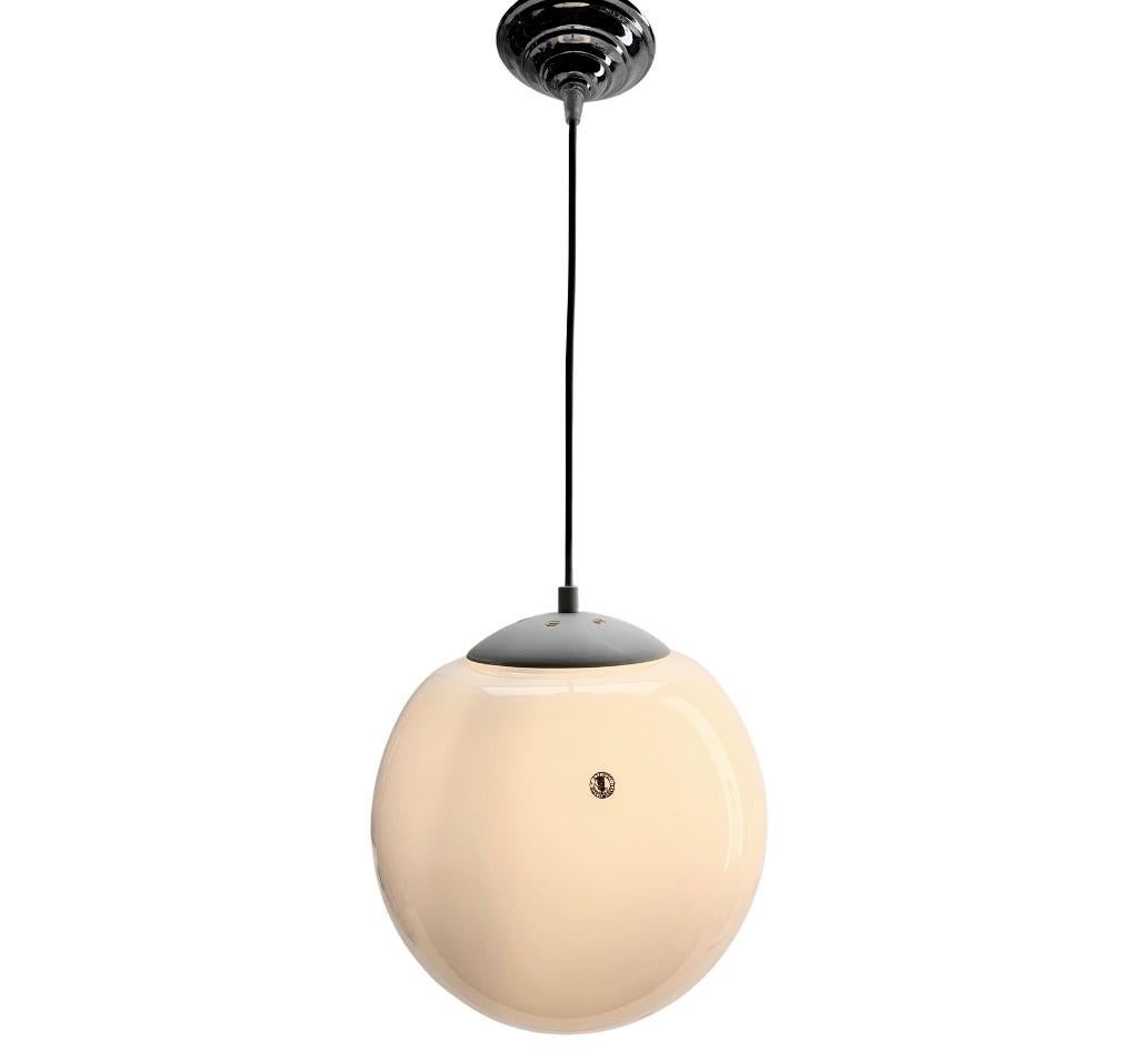 From the range by the Phillips Company, this center-light. 
The lamp has a fitting on a white Matel plate and holds a round globular shade of opaline glass. 
Size: Diameter 24 cm. Hand Made

In good condition and in full working order with standard