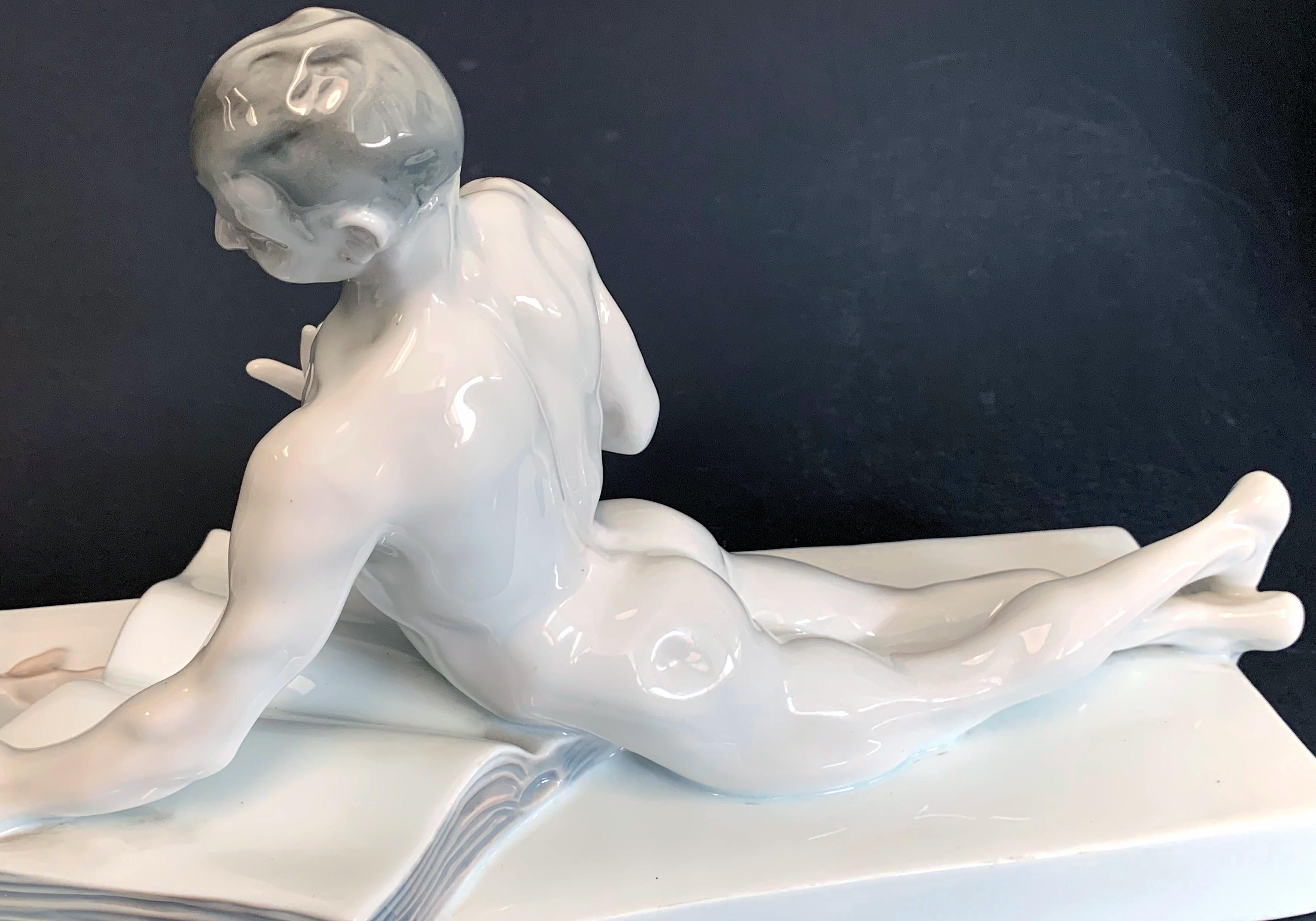A marvelous combination of whimsy and sensuosity, Ferdinand Liebermann's depiction of a nude youth holding forth with a stork, symbol of wisdom, was first cast in bronze in 1906, and later in porcelain by Rosenthal in 1911. The high gloss of the