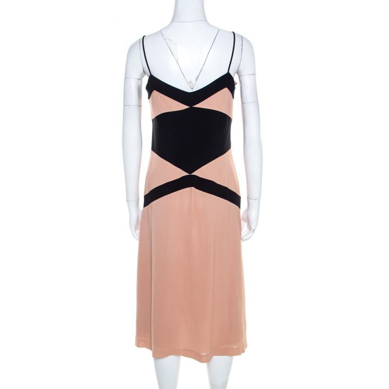 This creation is by Philosophy di Alberta Ferretti. Tailored from a fine fabric blend, the bicolor paneled flared dress features noodle strap. It comes with a back zipper, to comfortably adjust it. Team it with black stilettos for a refined