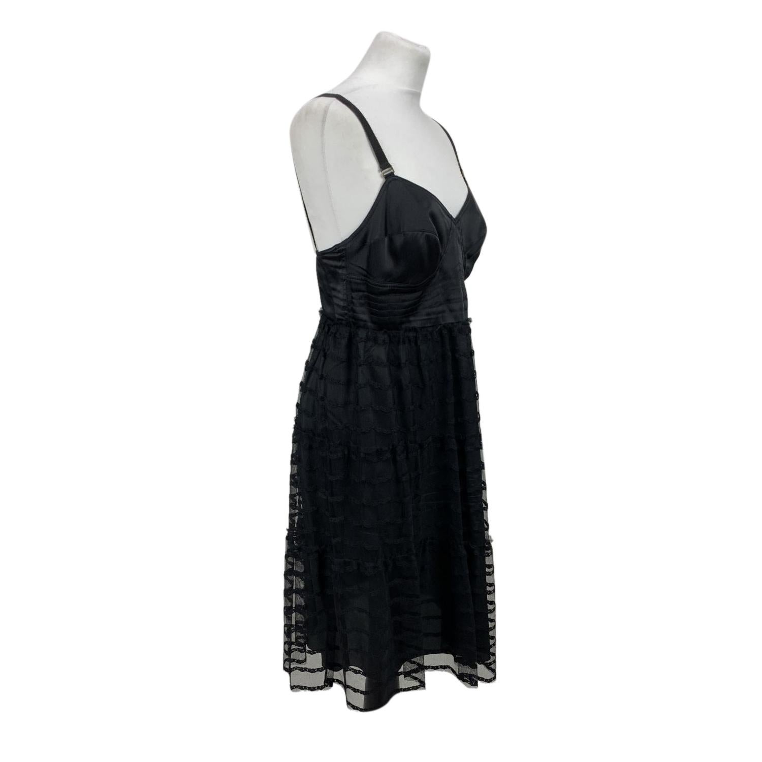 Philosophy by Alberta Ferretti Little black dress. Sleeveless design. Sweetheart neckline. Rear button and hook and eye closure. A-line skirt with mesh overlay. Composition: 1st fabric 100% polyester - 2nd fabric 100% Silk. Size: 44 IT, 40 F, 40 D,