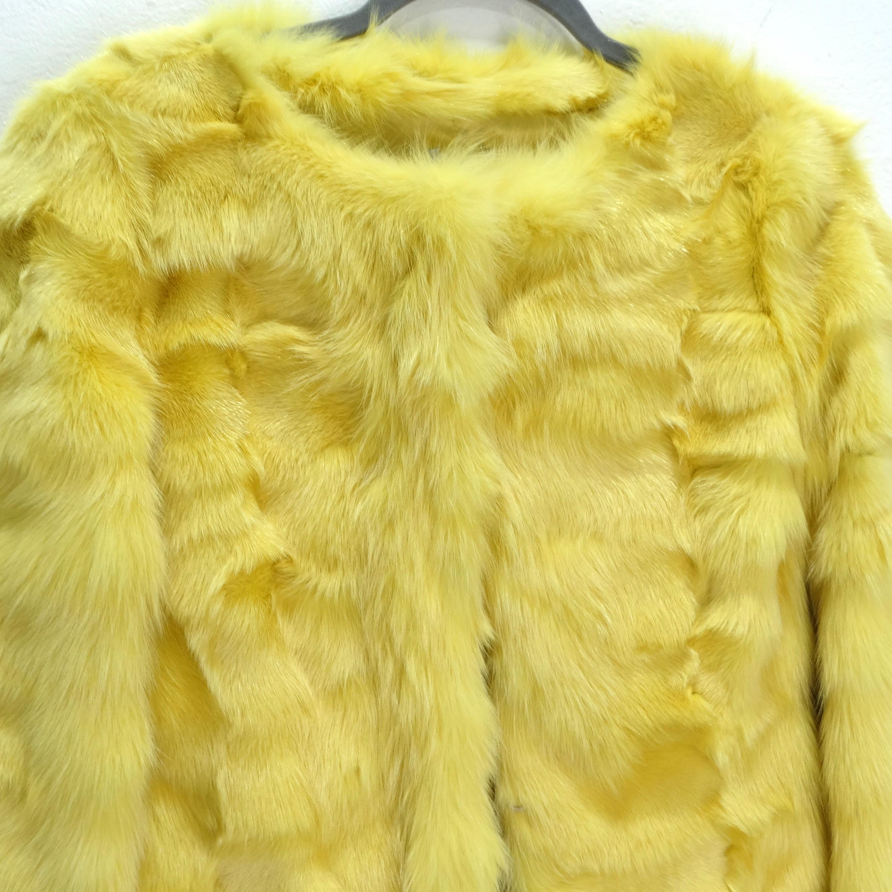 Introducing the Philosophy di Alberta Ferretti 1990s Yellow Fox Fur Coat—a stunning and bold expression of luxury and style. This mid-length coat is more than just outerwear; it's a wearable masterpiece crafted from vibrant yellow fox fur that