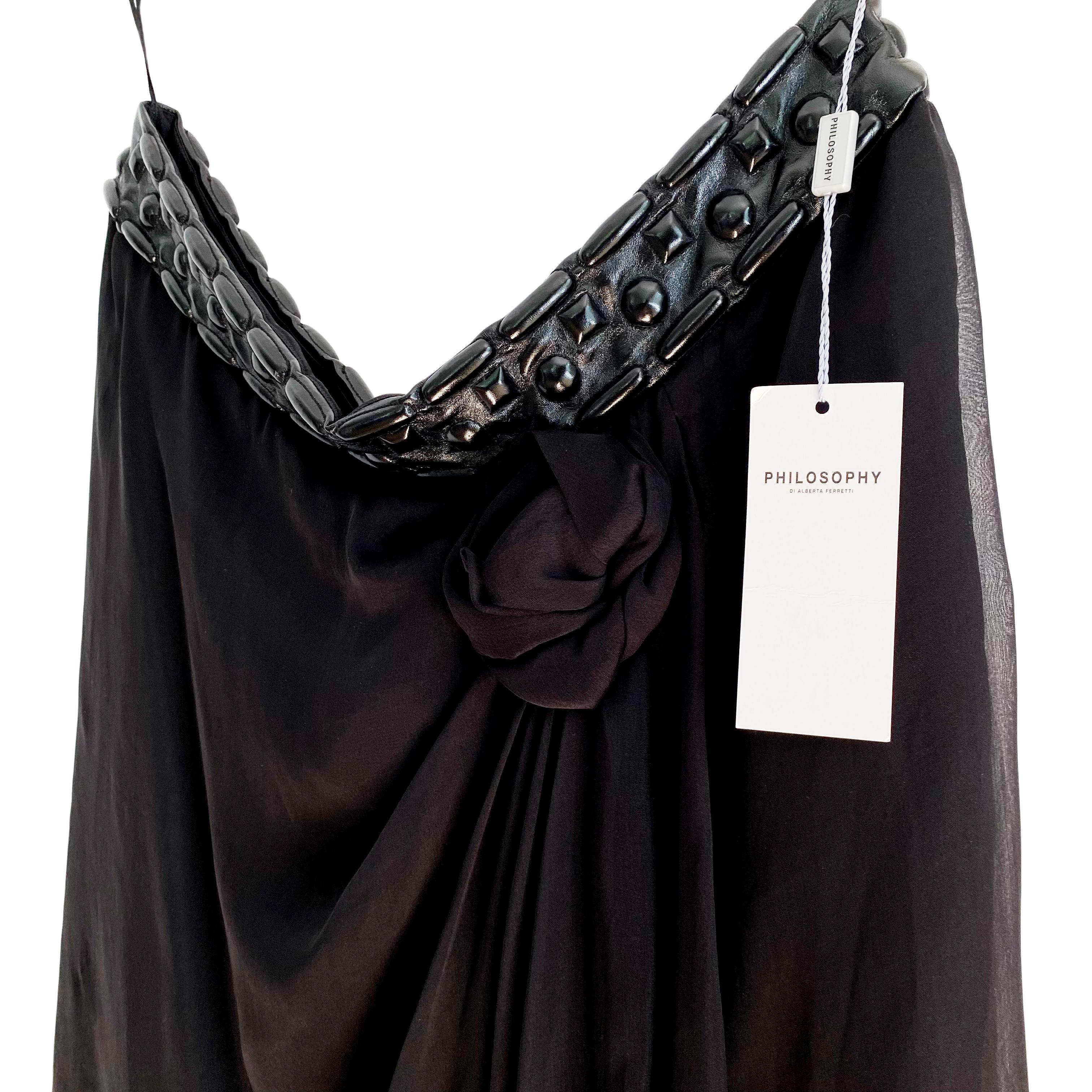 Pair with a simple top and let this embellished beautiful black silk skirt from Philosophy di Alberta Ferretti show off your fashion sense!
Leather-like contoured waistband. Invisible side zipper and hook/eye finish on left side.
Lined.
New with tag.
