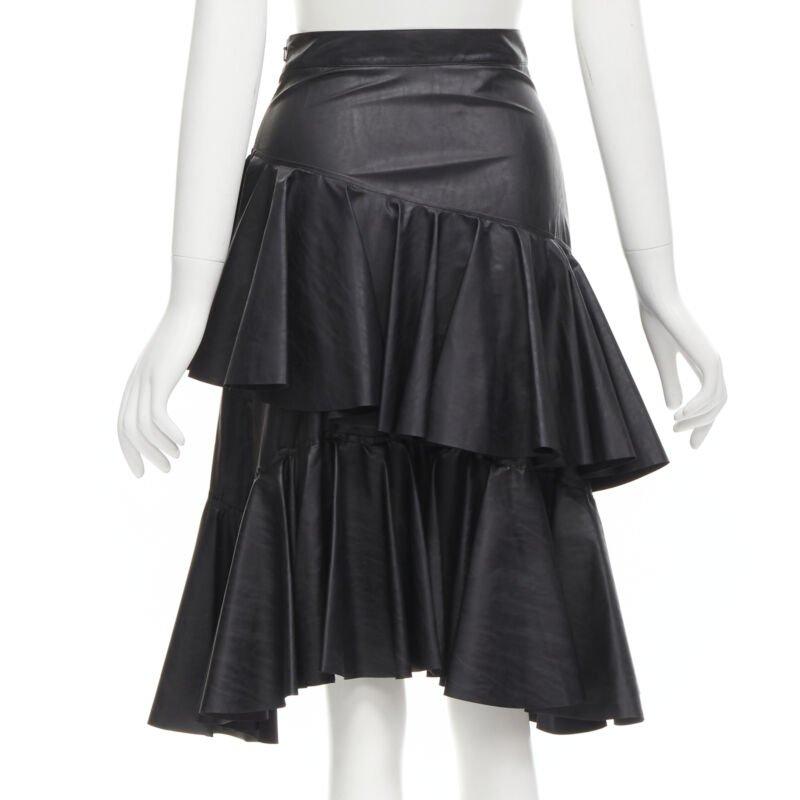 PHILOSOPHY DI LORENZO SERAFINI black faux leather asymmetric tier skirt IT38 XS
Reference: AAWC/A00377
Brand: Philosophy
Designer: Lorenzo Serafini
Material: Faux Leather
Color: Black
Pattern: Solid
Closure: Zip
Lining:  Fabric
Made in: