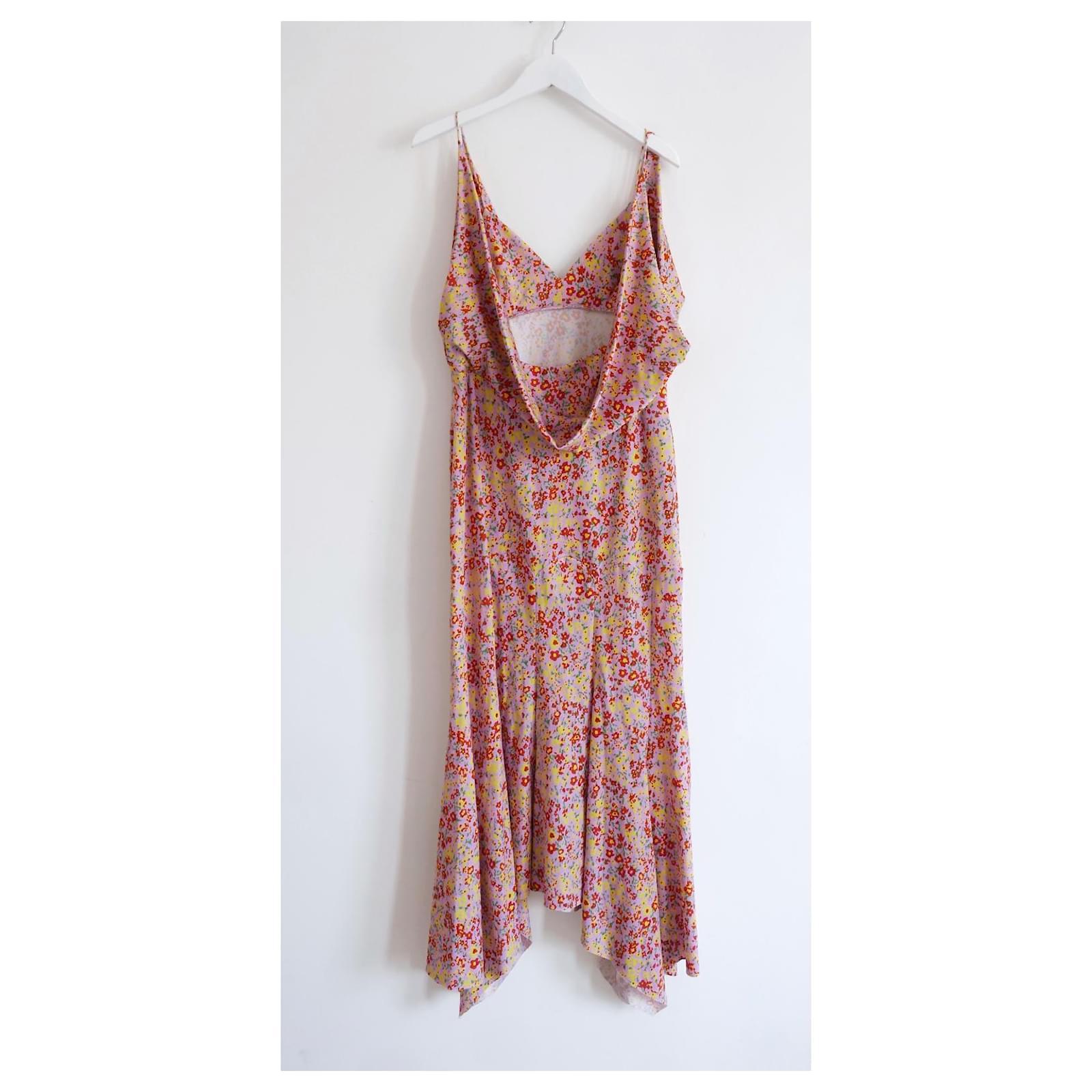 Gorgeous Philosophy di Lorenzo Serafini dress - bought for £750 and unworn. 
Made from smooth polyamide mix jersey with a pretty pink backed red and yellow 
ditsy floral print. Beautifully cut with curved panelling through the hips, handkerchief