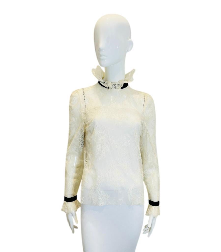 Brand New - Philosophy Di Lorenzo Serafini Lace Top
Ivory sheer blouse designed with floral lace pattern.
Detailed with high ruffled neckline and cuffs with black trim accents.
Size – 44IT
Condition – Brand New - With Labels
Composition – 100% Nylon
