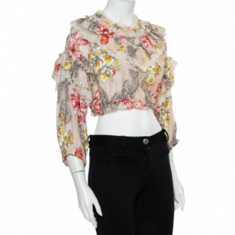 This Philosophy di Lorenzo Serafini crop top is perfect for a daytime event! Made from cotton in a pink shade, this creation is adorned with floral prints and ruffles for a feminine finish. Style this piece with a pleated skirt and pumps.