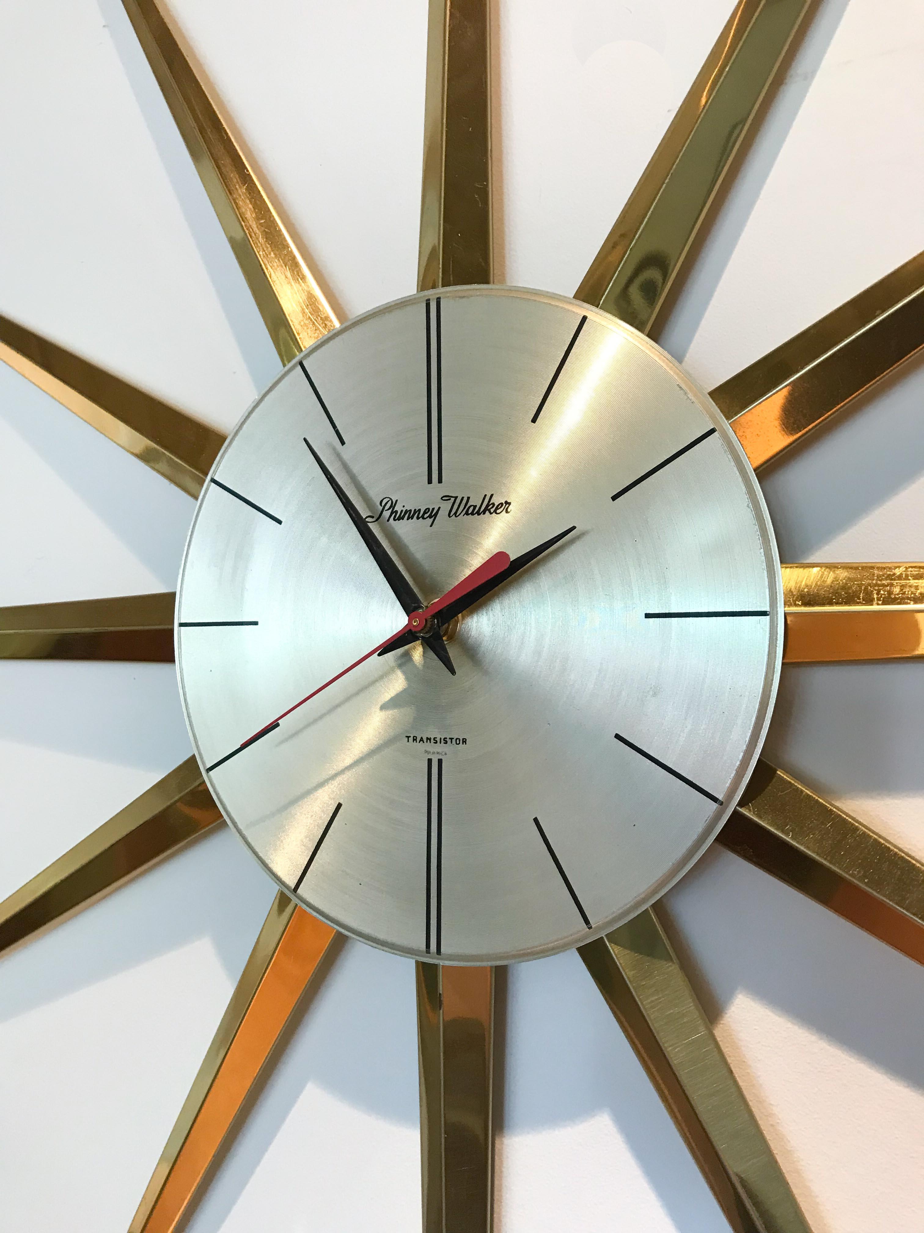 Phinney Walker Starburst wall clock. Brass body with new motor.