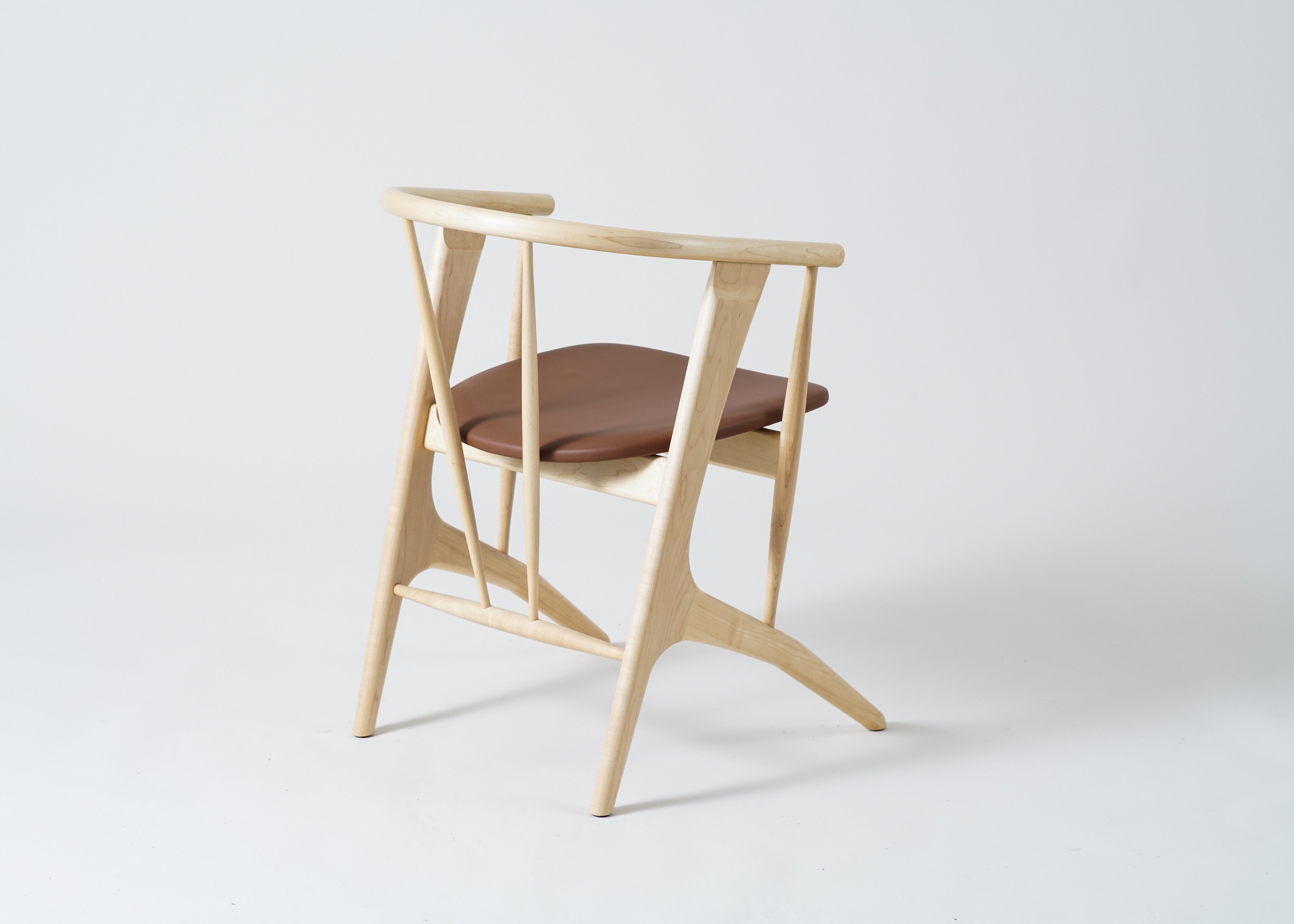 Phloem Studio Zoe chair is a modern contemporary solid wood armchair handmade custom to order.
Zoe is a highly crafted, highly comfortable lightweight armchair designed for long dinner parties or a working late. The angled solid steam bent back