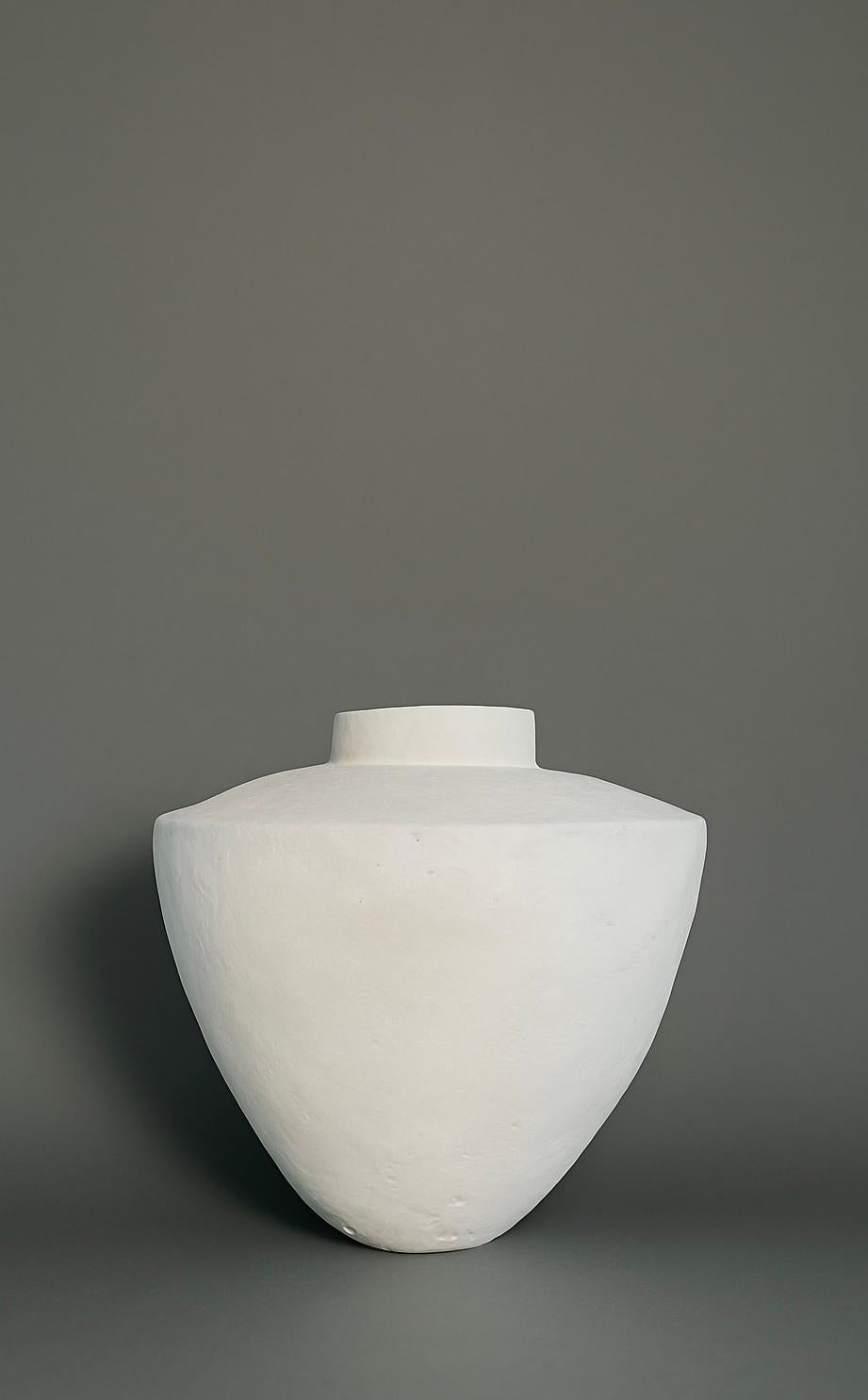 This vessel is inspired by ancient Phoenician forms yet reimagined through a minimalist, modern lens—creating a striking silhouette that feels both timeless and architectural. Hand-sculpted using a proprietary plaster-clay composite, each piece