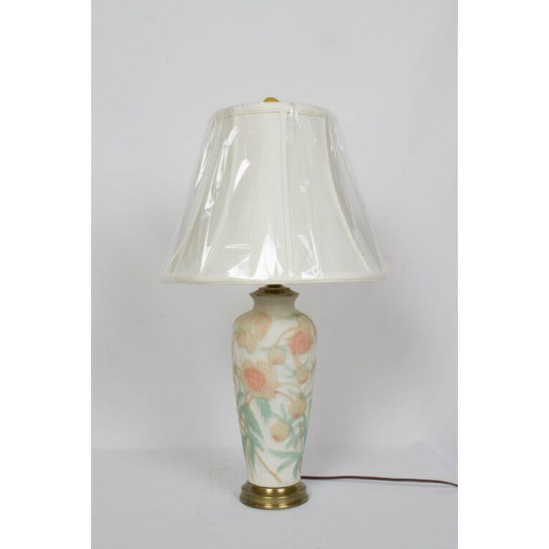 Phoenix glass lamp. Vase made by Phoenix Glass Company out of Monaca PA. C. 1930. 
Off white sculpted glass with peony pattern. Background is an ivory, and flowers are cream with salmon orange centers and green leaves. frosted glass finial.