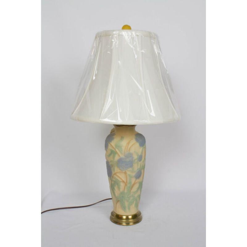 Phoenix Consolidated Glass Lamp with Blue Flowers. Vase made by Phoenix Glass Company out of Monaca PA. C. 1930. New Wiring and electrical. Includes harp and finial. Lampshade sold separately. 18″ height lamp only, 26″ to top of finial.

Dimensions: