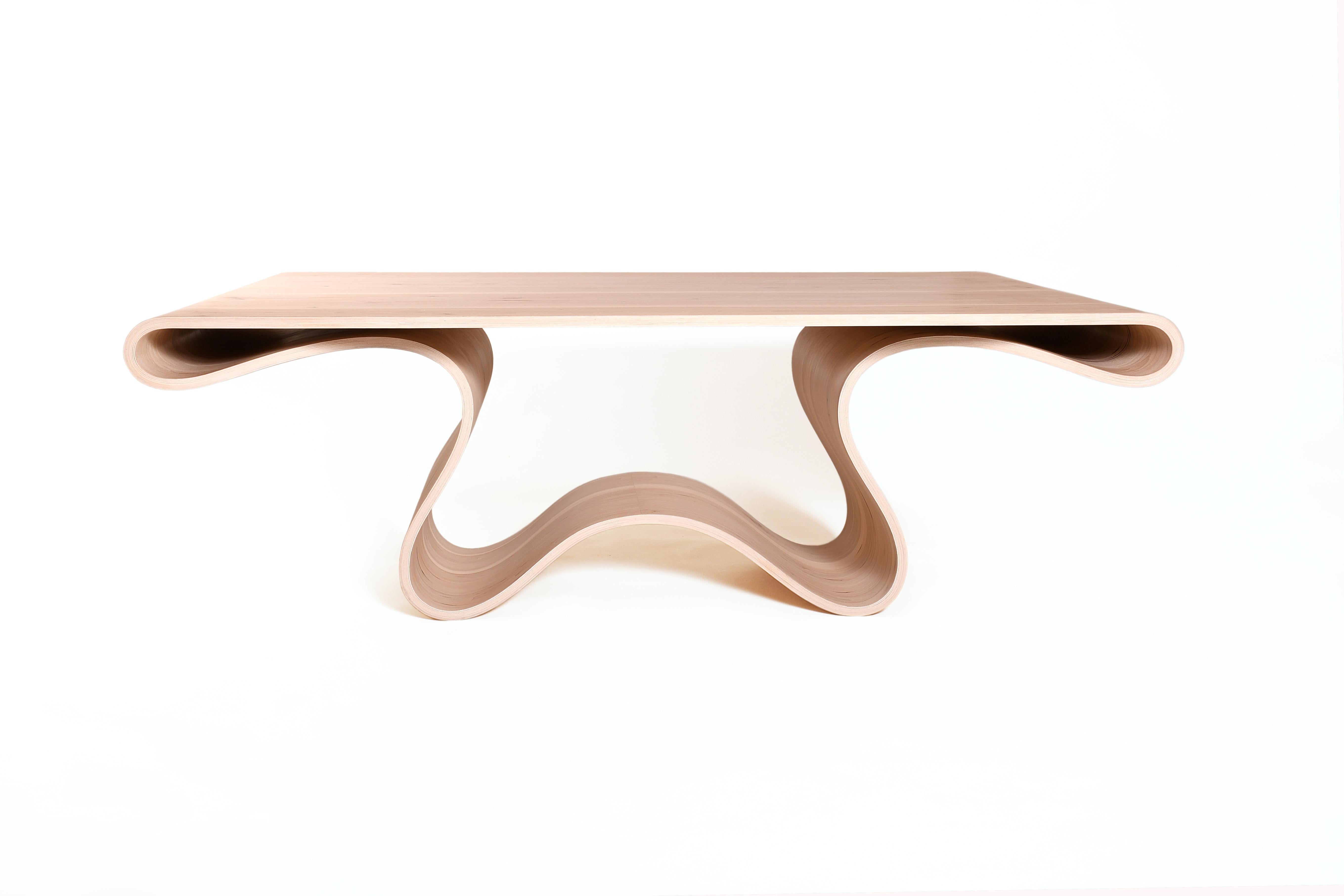 The design of this dining table is unique and spectacular, it would be a great touch of modernity in your home design.

This table is the result of all my research into wood bending, to create this piece I had to use several techniques and draw on