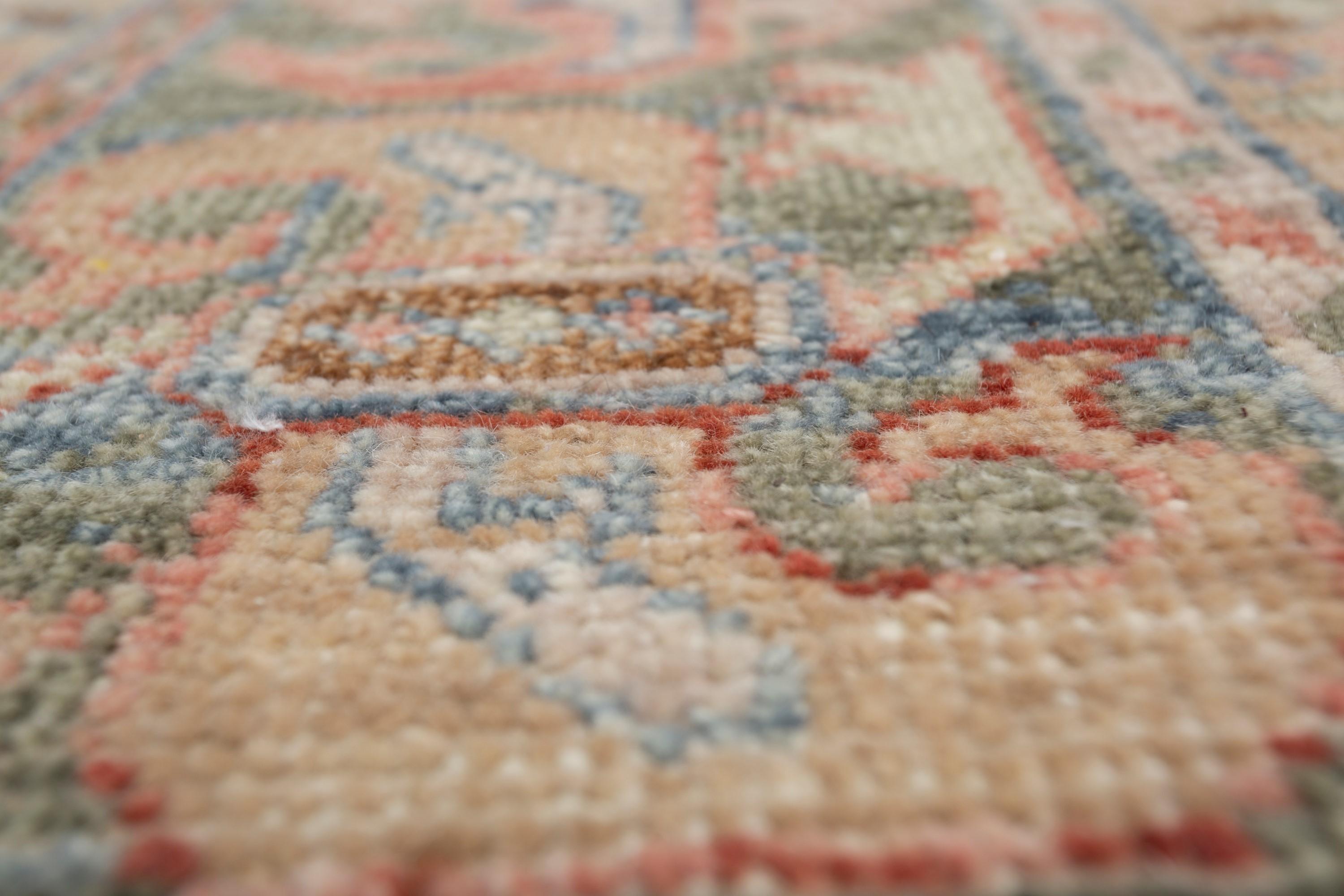 Enter a realm where captivating contrasts thrive, as tradition gracefully intertwines with modernity in the exquisite craftsmanship of this hand-knotted rug. Meticulously woven, it unveils a captivating narrative through its intricate dance of