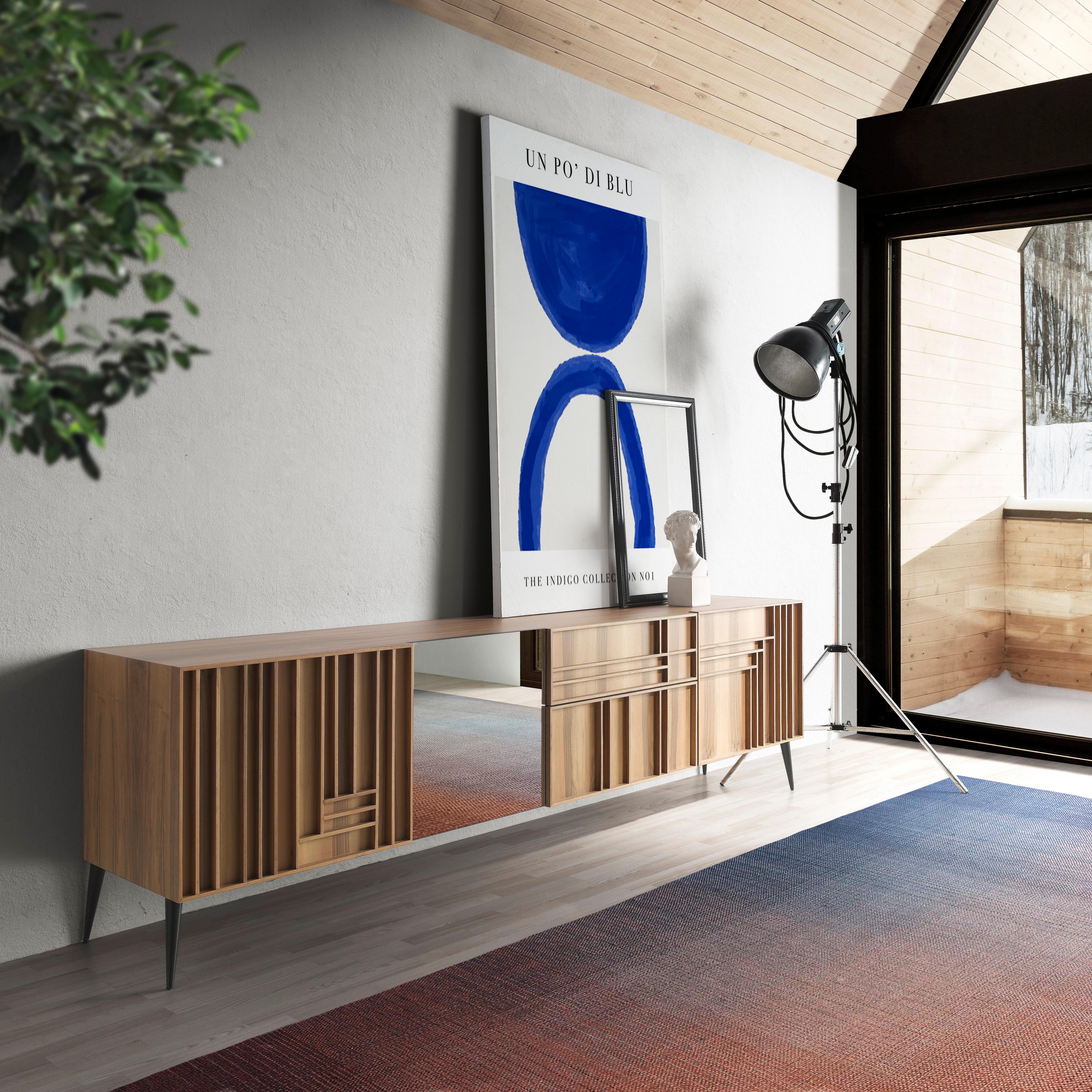 Phoenix Sideboard by Lola Glamour
Dimensions: D 46 x W 250 x H 72 cm
Materials: Walnut.

This spacious sideboard has three doors with interior shelves and two drawers. The pattern of its horizontal and vertical lines masterfully intertwines to