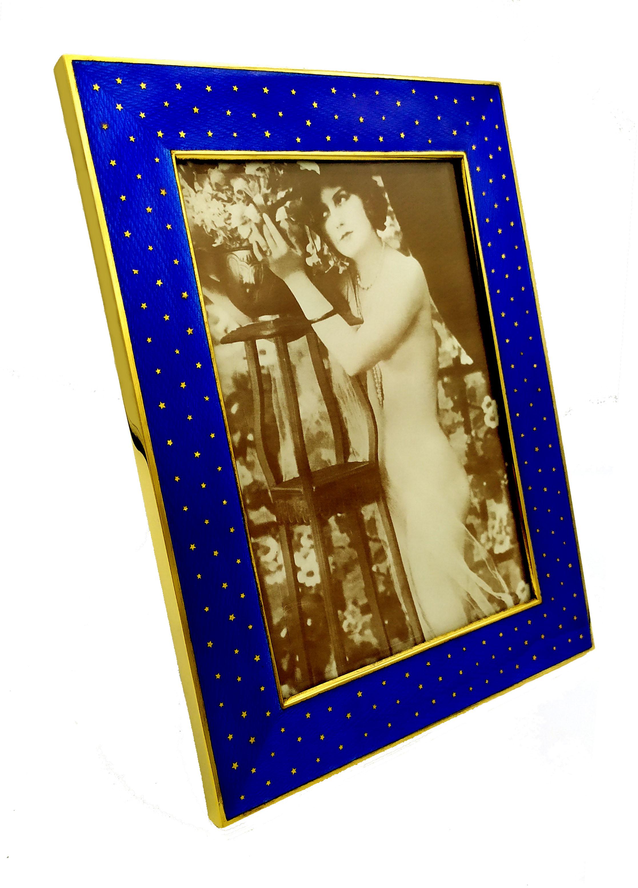 Rectangular photo frame in 925/1000 sterling silver gold plated with translucent blue fired enamel on guillochè and with the insertion of pure gold 