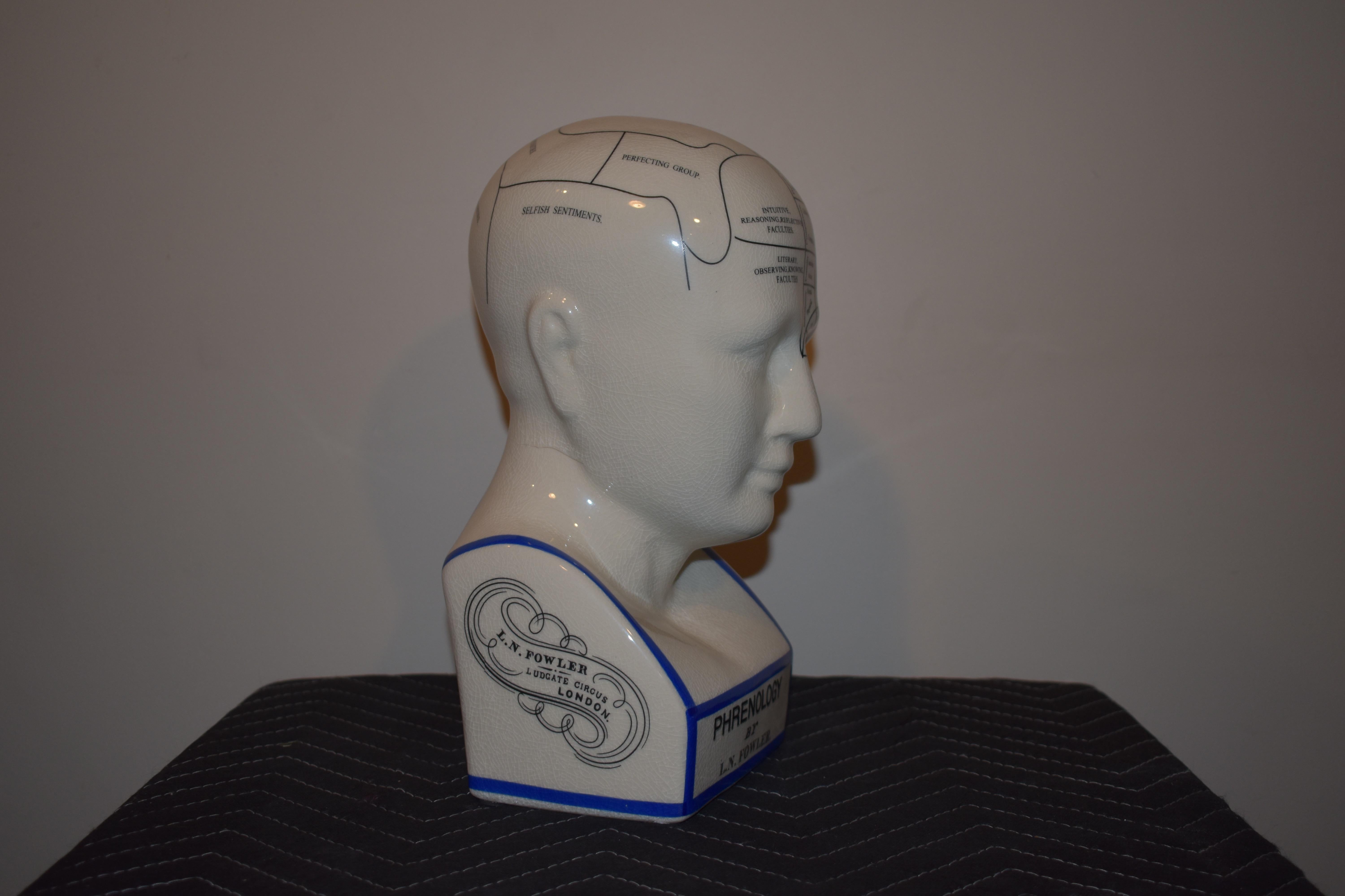 Phrenology by L.N Fowler. Later reproduction. Very good condition. Makes a great mantle piece or a place to store hats and headphones. 

Measures: 12
