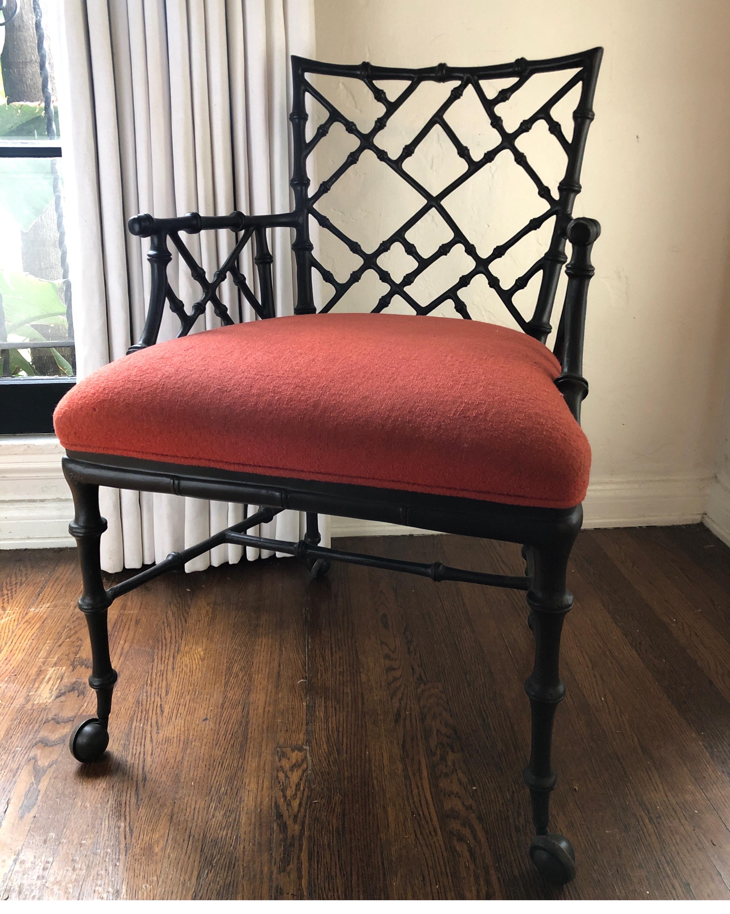 Phyllis Morris solid iron armchair on bronze castors.
Hollywood Regency style with newly upholstered red tweed fabric. Very durable.
 