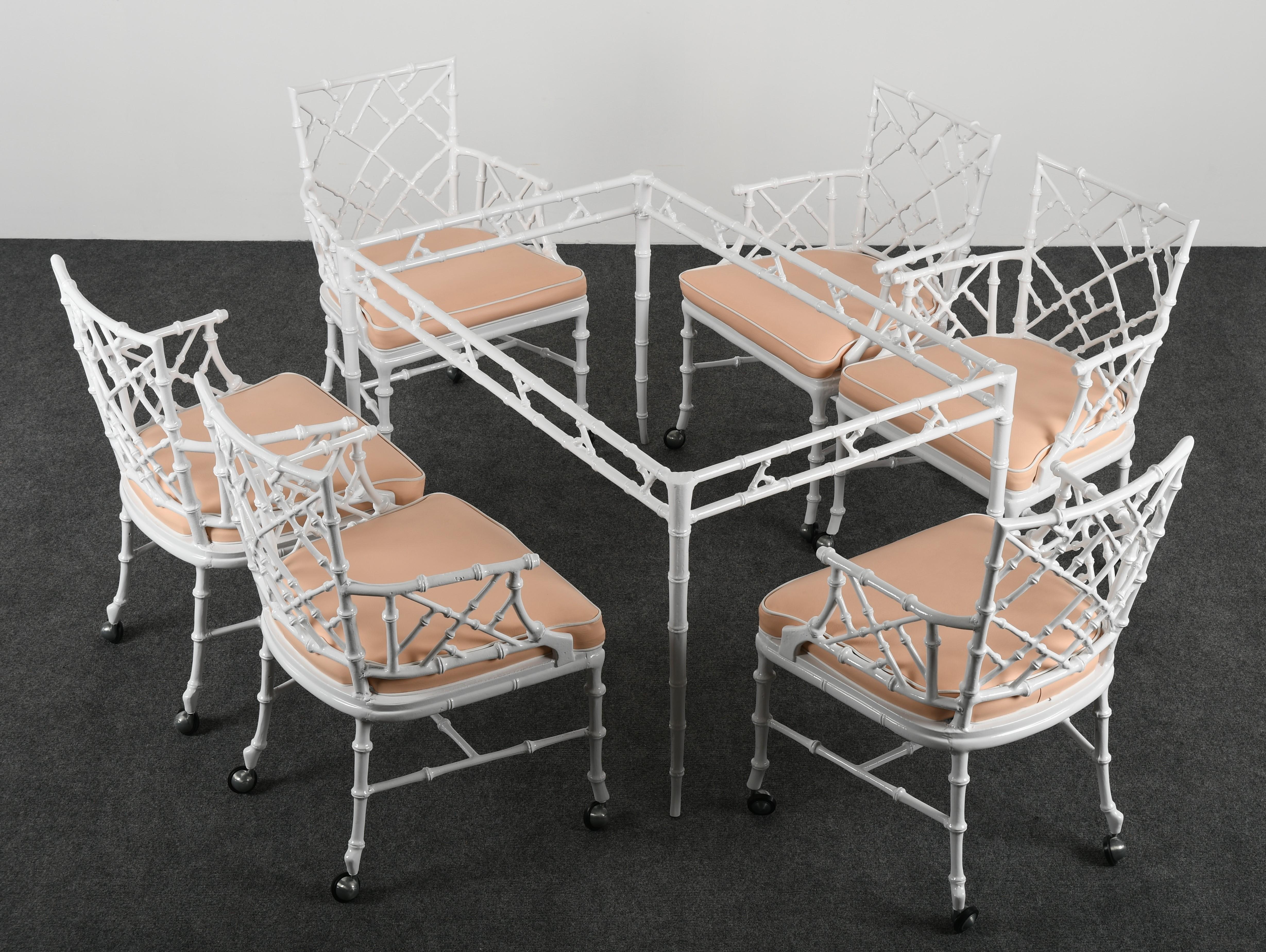 Phyllis Morris faux bamboo patio set for Kessler Industries, 1960s. This faux bois aluminum patio set consists of 7 pieces with its original vinyl seat covering. The patio set has been newly powder coated. Vinyl upholstery is in good condition with