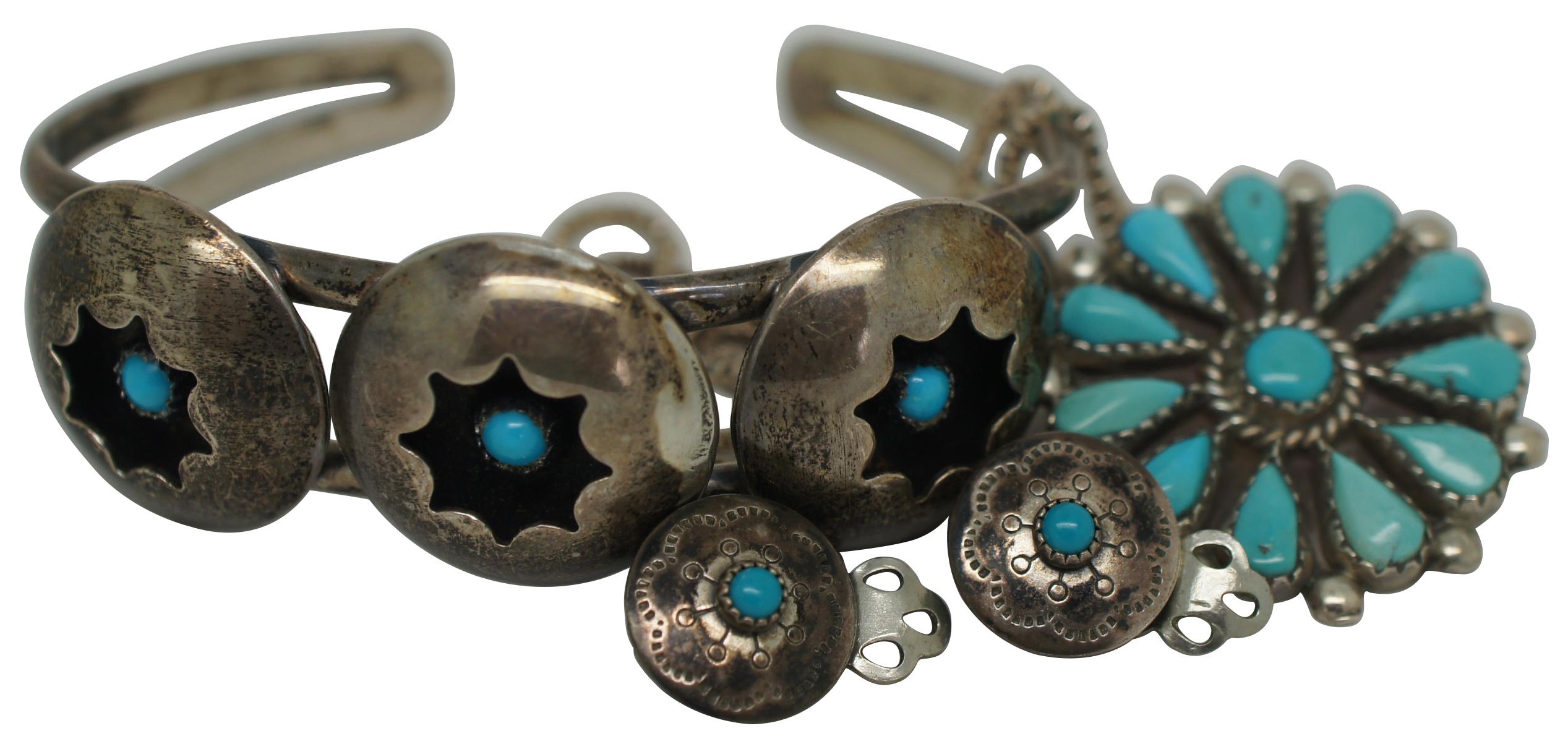 Vintage set of Native American / Navajo Zuni petit point turquoise sterling silver jewelry including a cuff bracelet, clip on earrings and a pendant / pin by artisan Phyllis Gilbert Ortega.

Zuni Petit point Jewelry began around 1920-1930 and was
