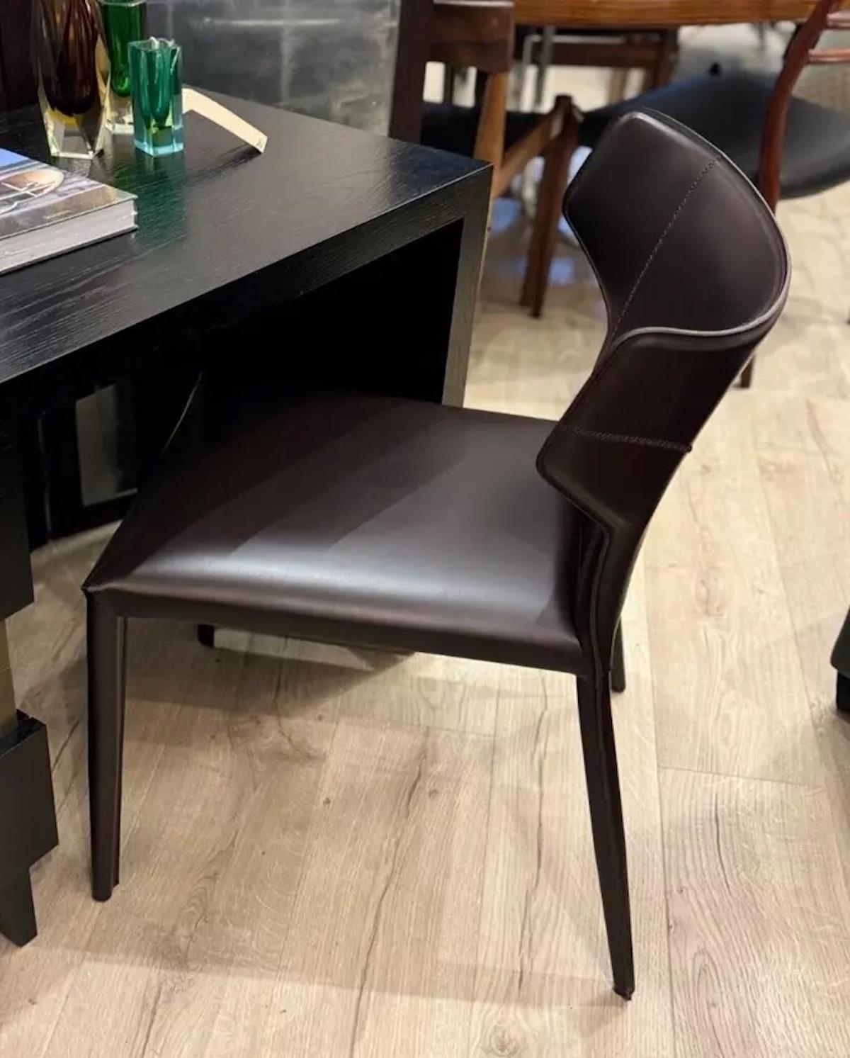 The Pi Greco accent chair by Natuzzi Italia is a versatile chair suitable for use as a dining chair, dressing table chair or even a desk chair. It has a slight curved backrest for added support and comfort. 

Featuring a tone-on-tone stitching, it