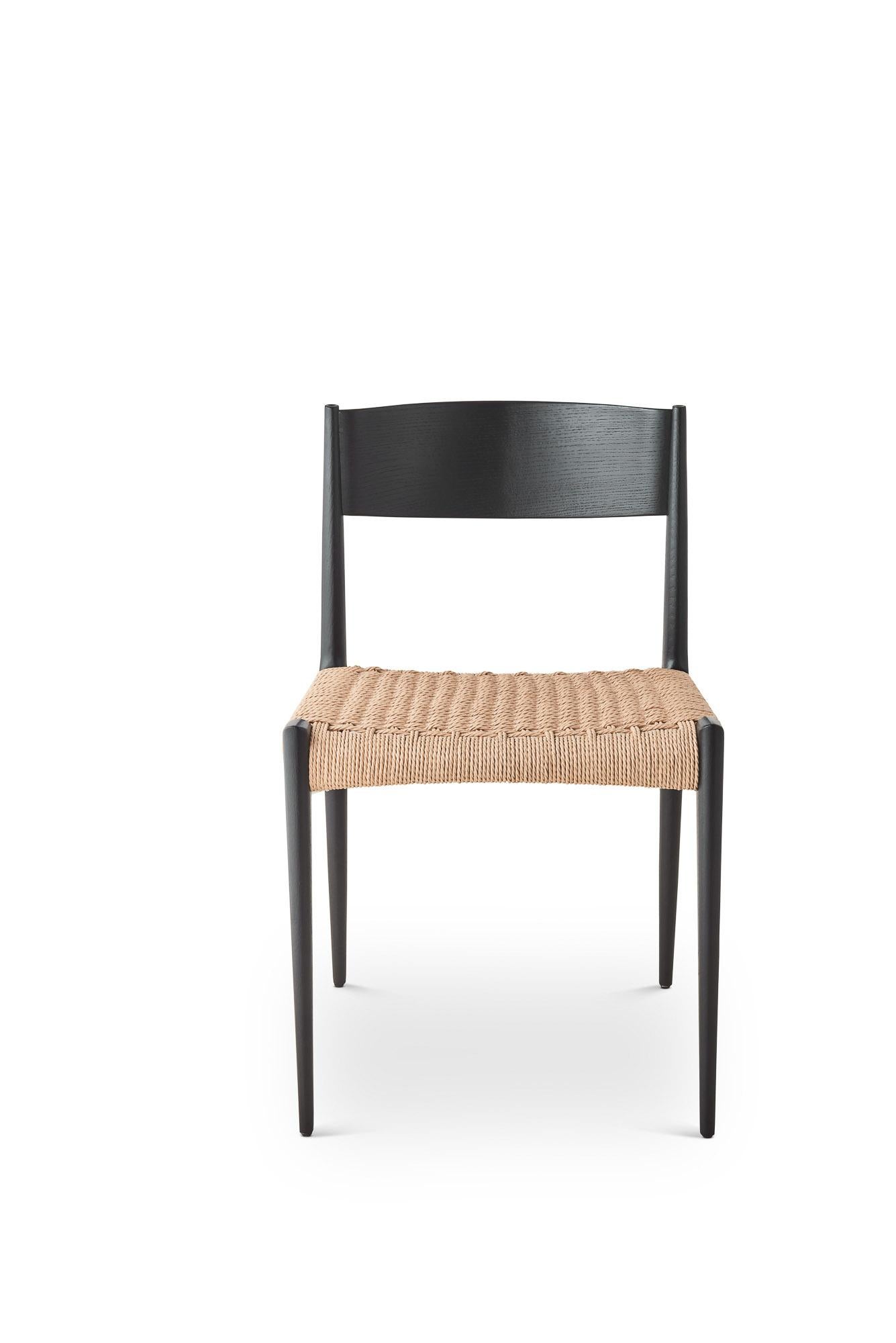 PIA Chair
Solid oak frame, paper cordel seat
Dimensions: H75 x 49 x 48 cm (seat height 45cm)

Wood:
– Oak
– Smoked oak
– Black lacquered oak
– Walnut

Paper cordel:
– Natural
– Black

--
The Pia chair signed by DK3 was imagined and designed by the