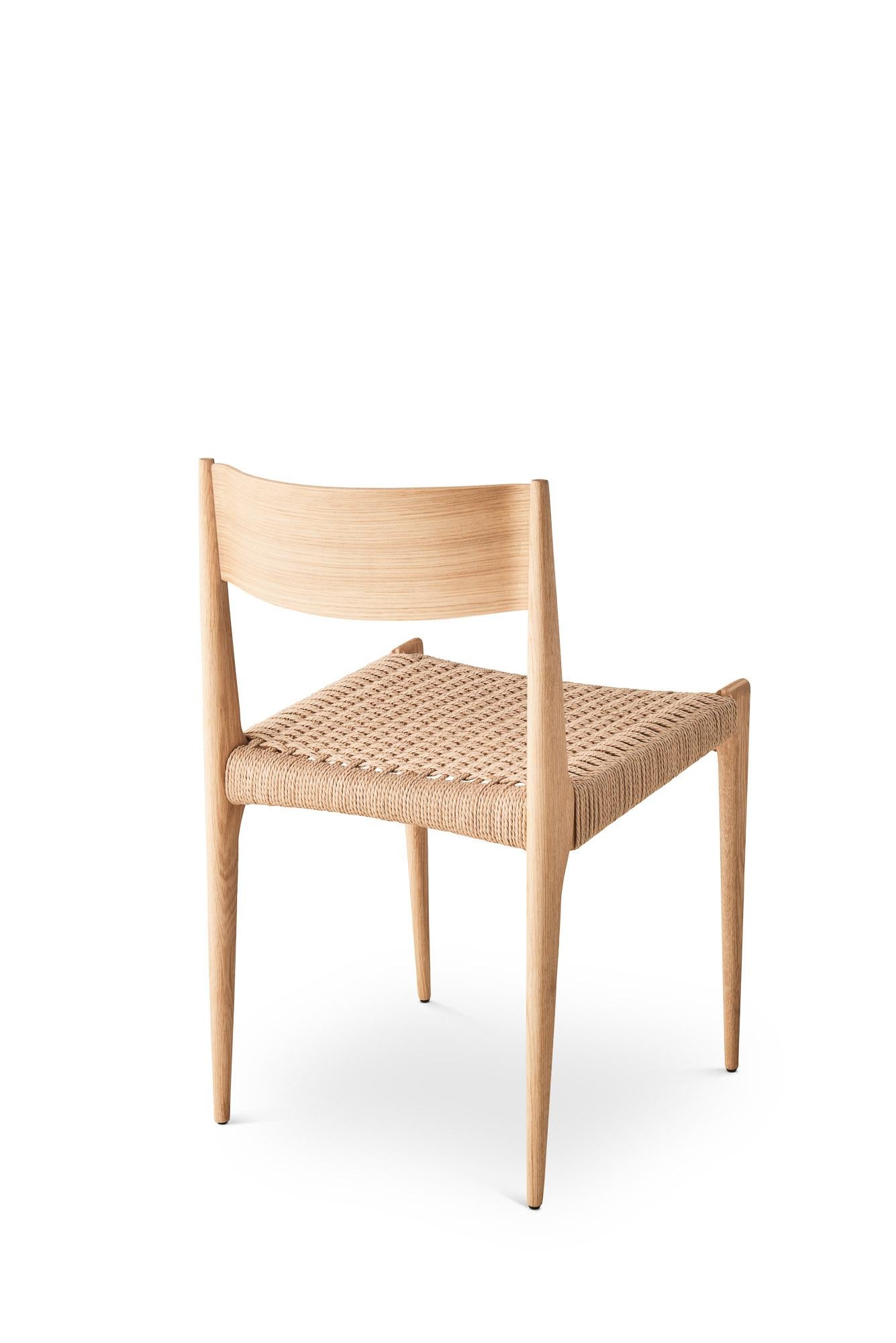 PIA Chair
Solid oak frame, paper cordel seat
Dimensions: H75 x 49 x 48 cm (seat height 45cm)

Wood:
– Oak
– Smoked oak
– Black lacquered oak
– Walnut

Paper cordel:
– Natural
– Black (Contact us)

--
The Pia chair signed by DK3 was imagined and